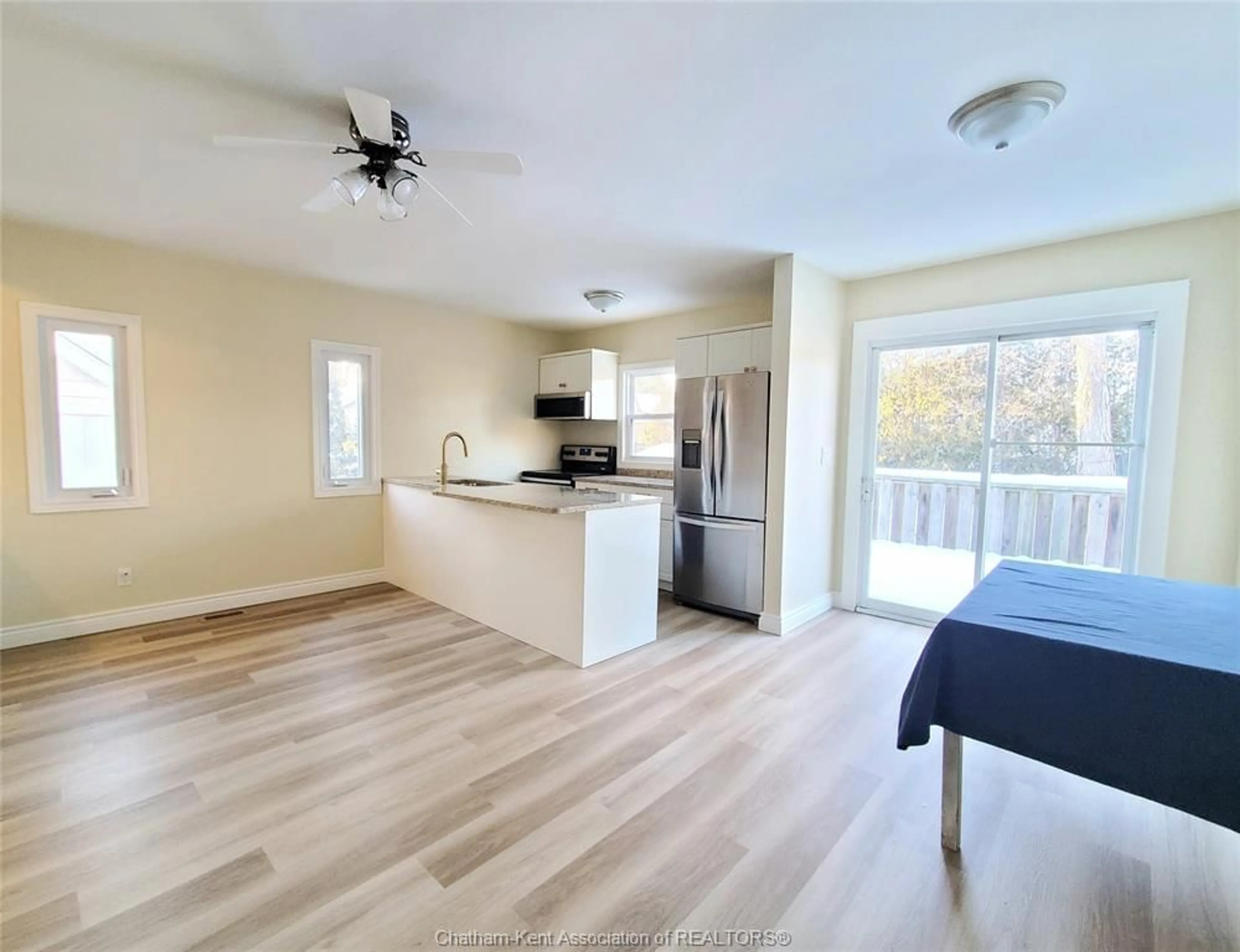 Open concept kitchen, wood/laminate floor for 36 Tissiman Ave, Chatham Ontario N7M 4G5