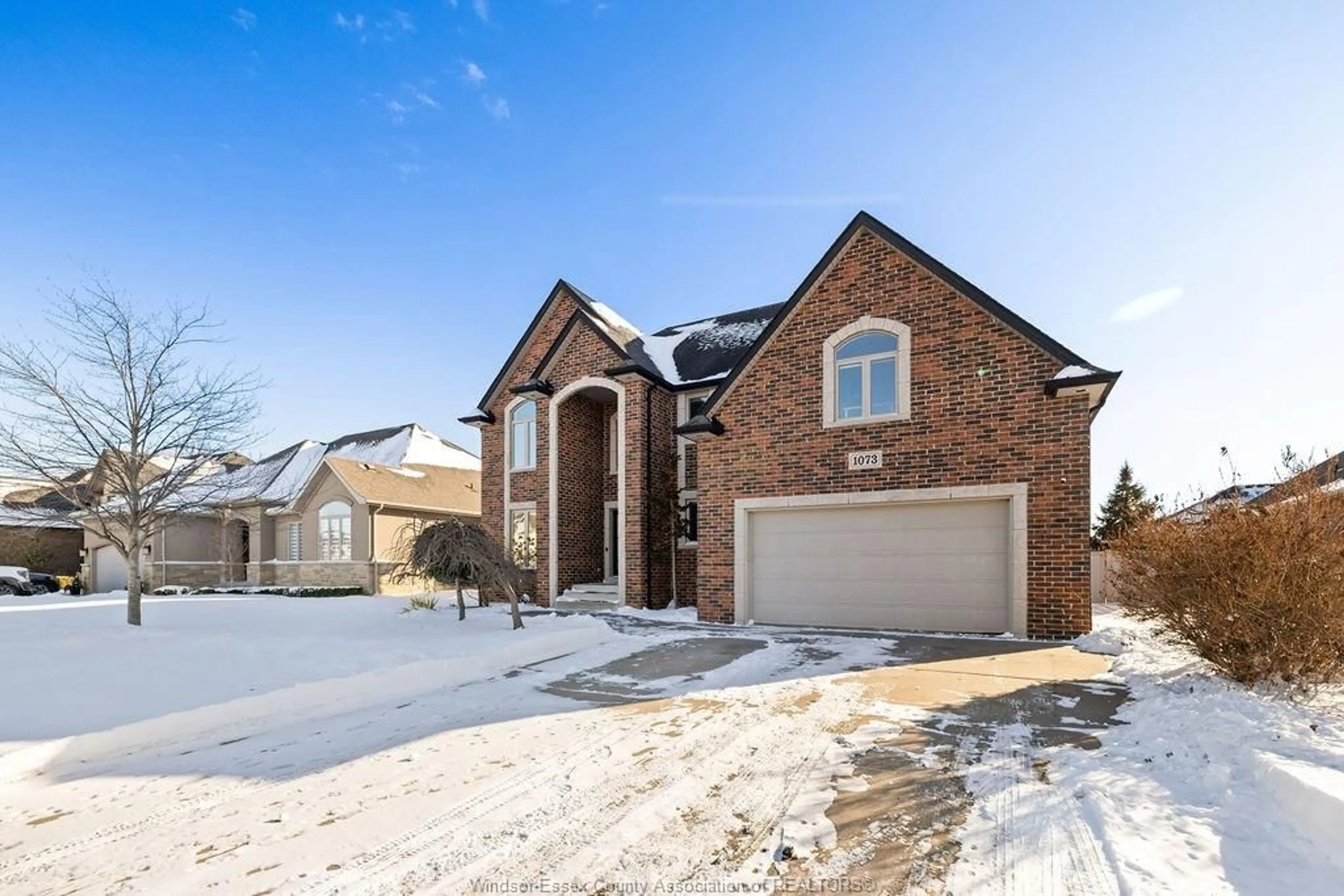Home with brick exterior material, street for 1073 REGENCY Cres, Lakeshore Ontario N0R 1A0