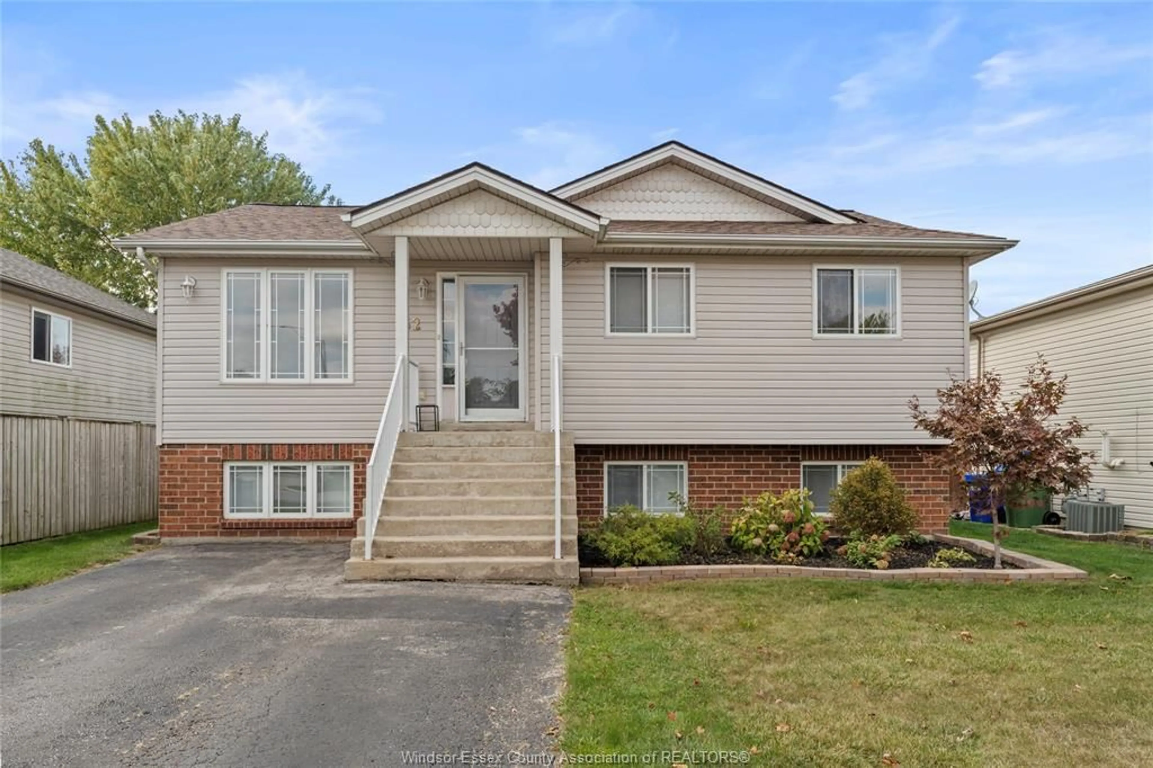 Home with vinyl exterior material, street for 62 BRATT Dr, Amherstburg Ontario N9V 4A2