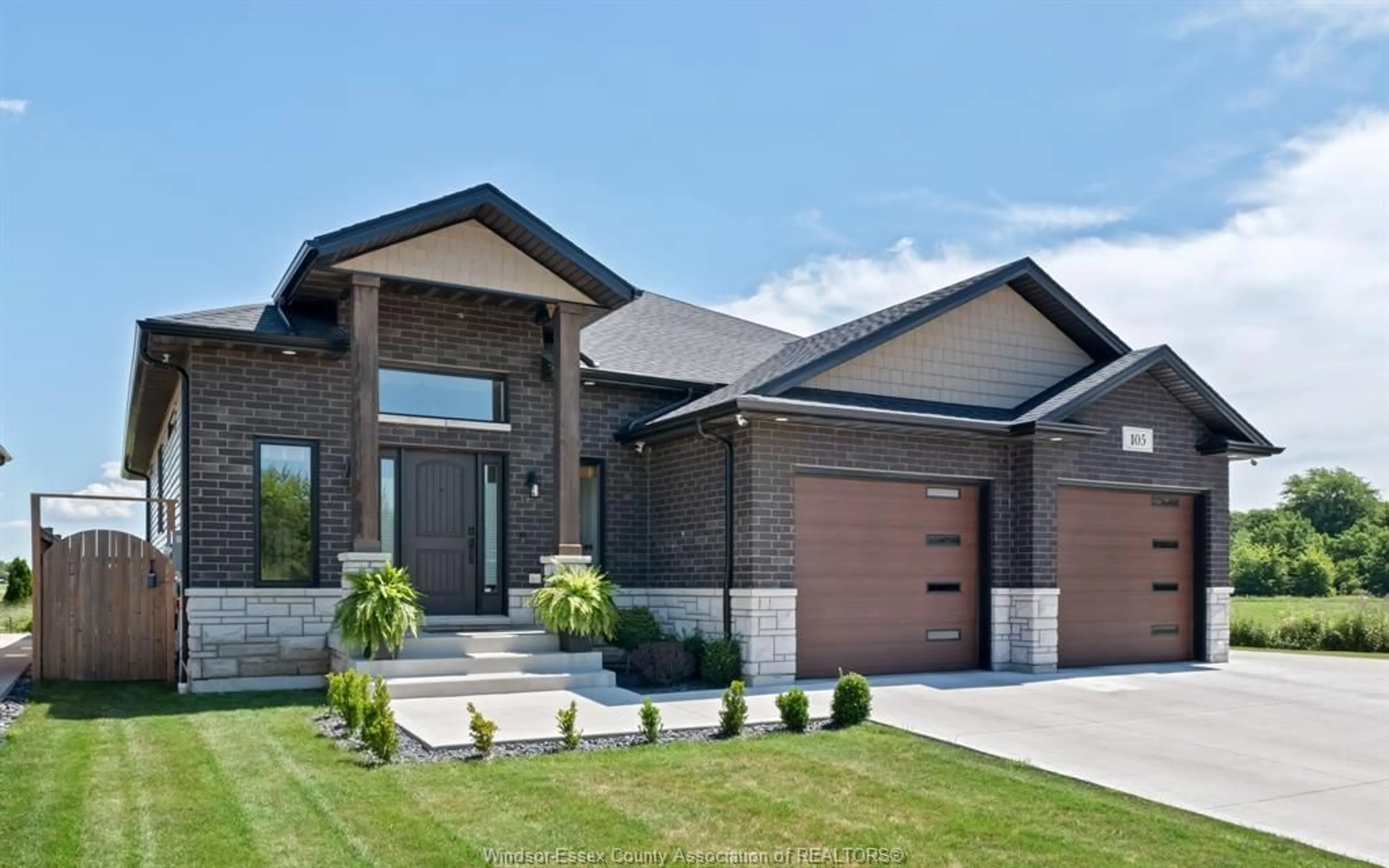 Home with brick exterior material, street for 105 CONSERVATION Blvd, Kingsville Ontario N9V 0E4