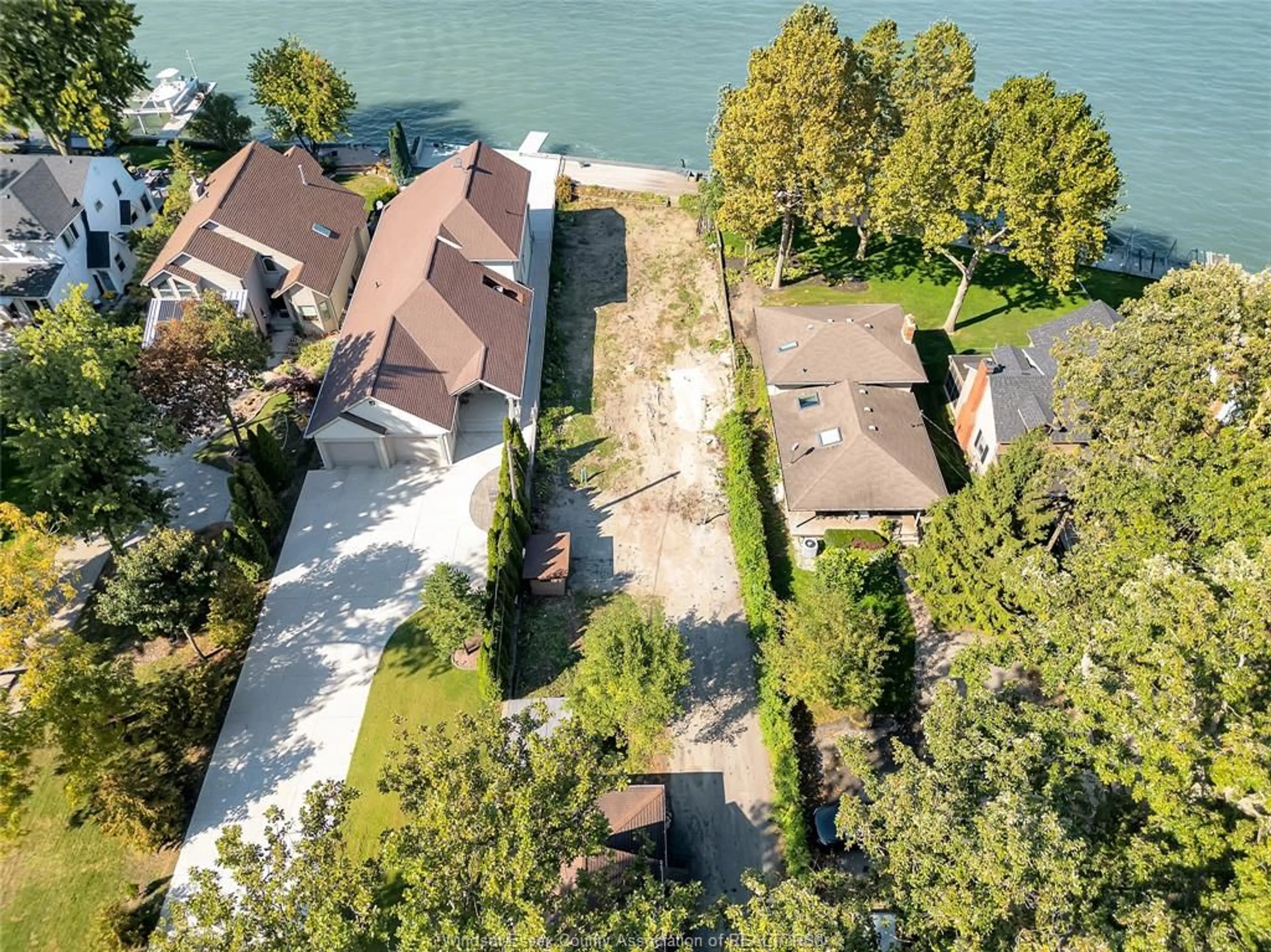 A pic from outside/outdoor area/front of a property/back of a property/a pic from drone, water/lake/river/ocean view for 12718-12722 RIVERSIDE Dr, Tecumseh Ontario N8N 1A7