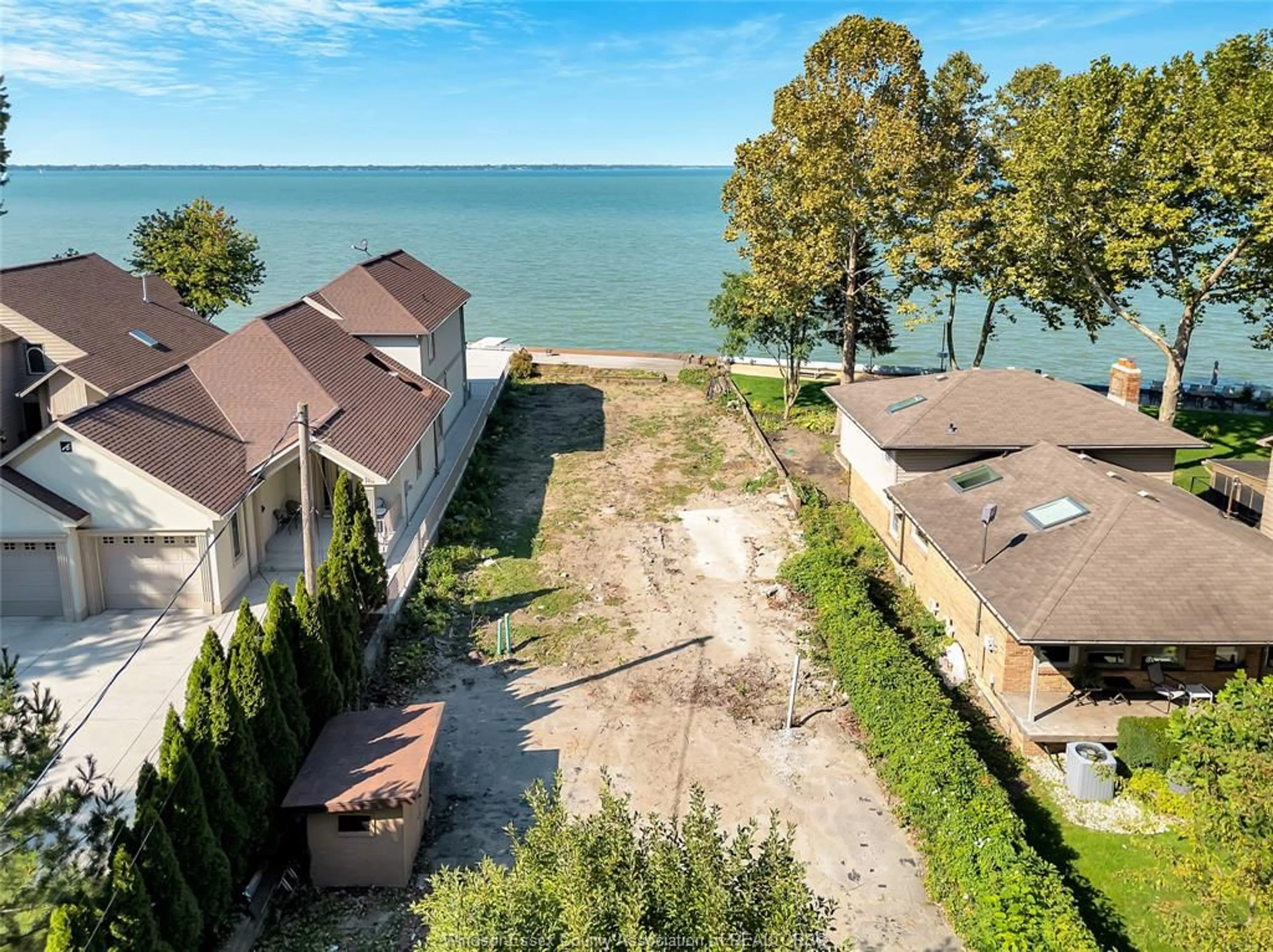 A pic from outside/outdoor area/front of a property/back of a property/a pic from drone, water/lake/river/ocean view for 12718-12722 RIVERSIDE Dr, Tecumseh Ontario N8N 1A7