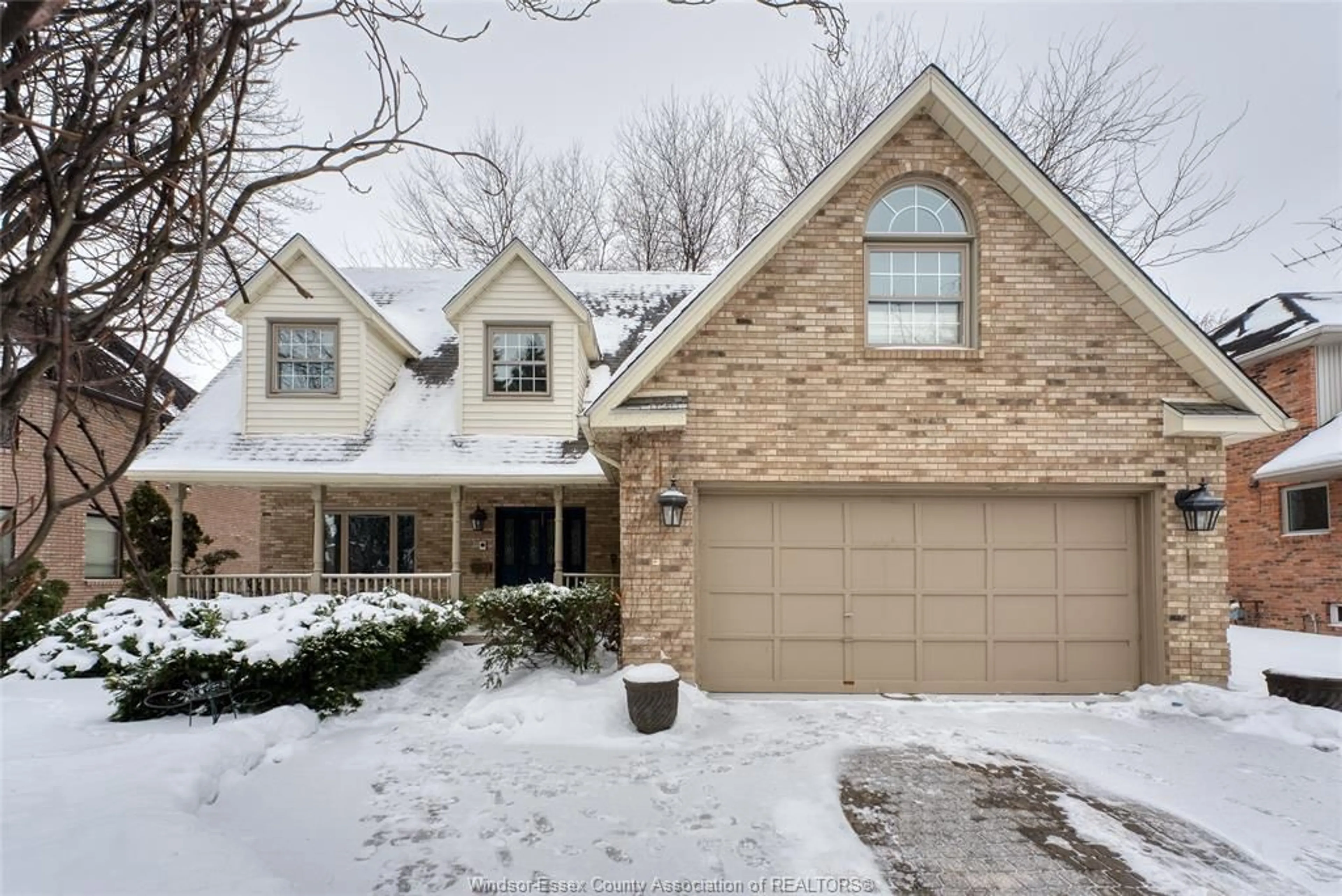 Home with brick exterior material, street for 323 MAJESTIC Dr, Lakeshore Ontario N8N 4K9