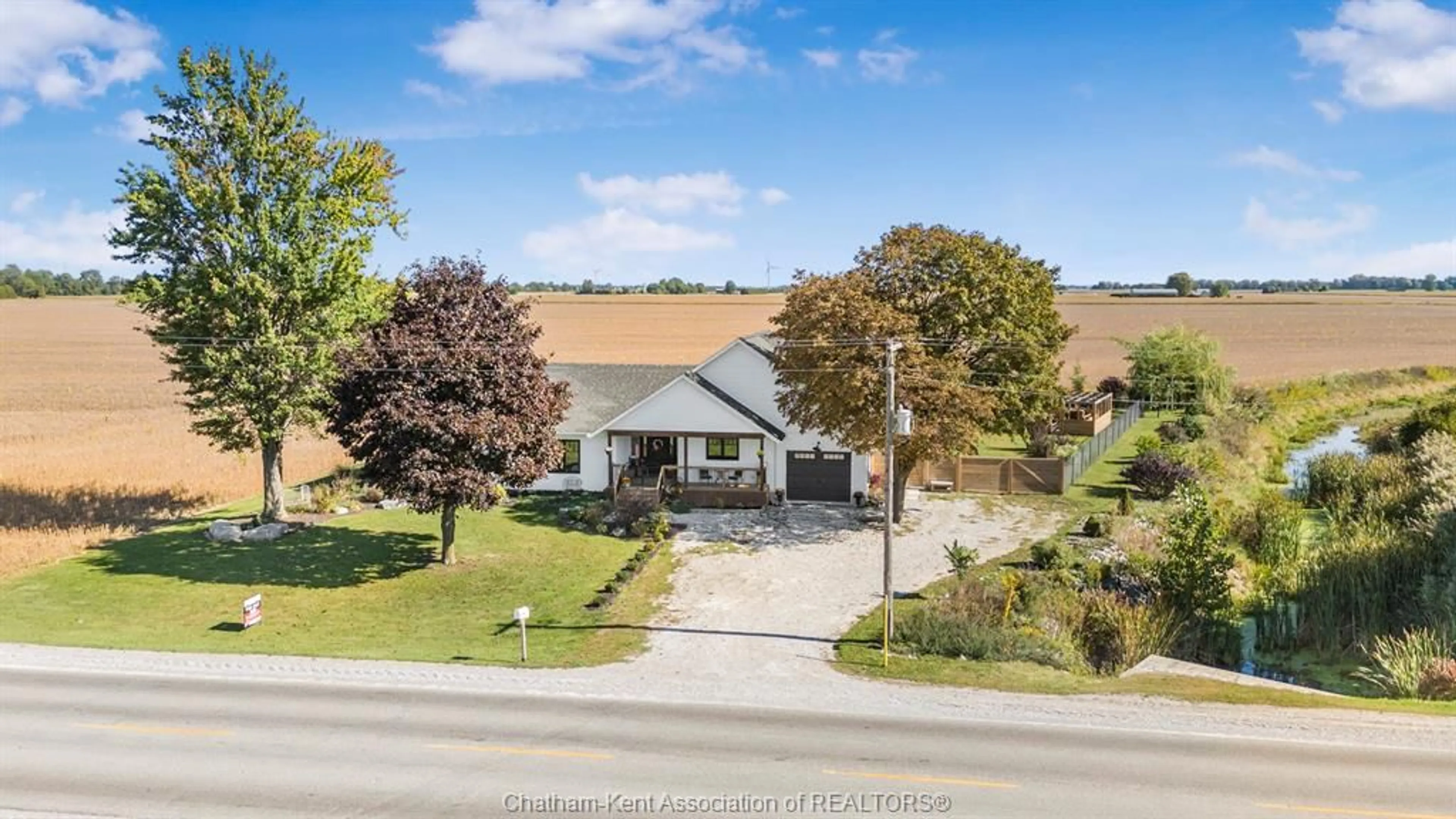 A pic from outside/outdoor area/front of a property/back of a property/a pic from drone, street for 24947 Bear Line Rd, Chatham-Kent Ontario N7M 5J8