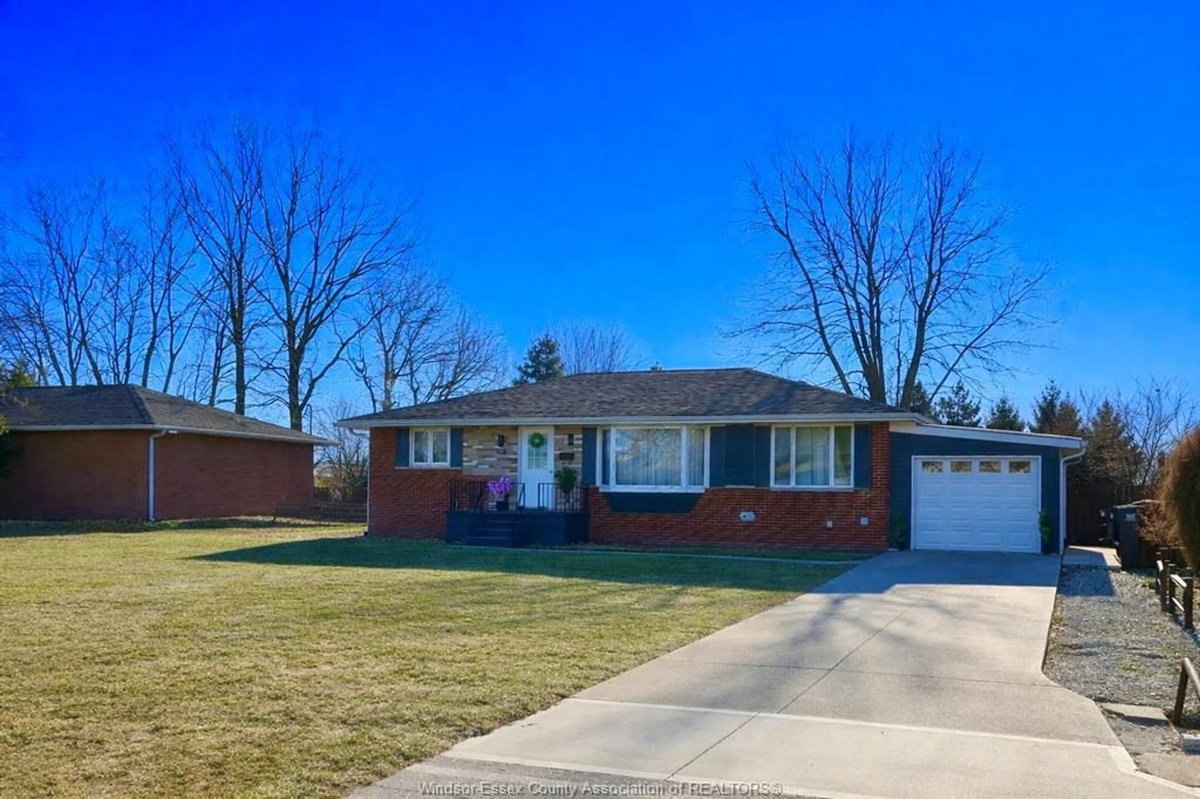 Home with brick exterior material, street for 310 MARTIN Lane, LaSalle Ontario N9J 2M3