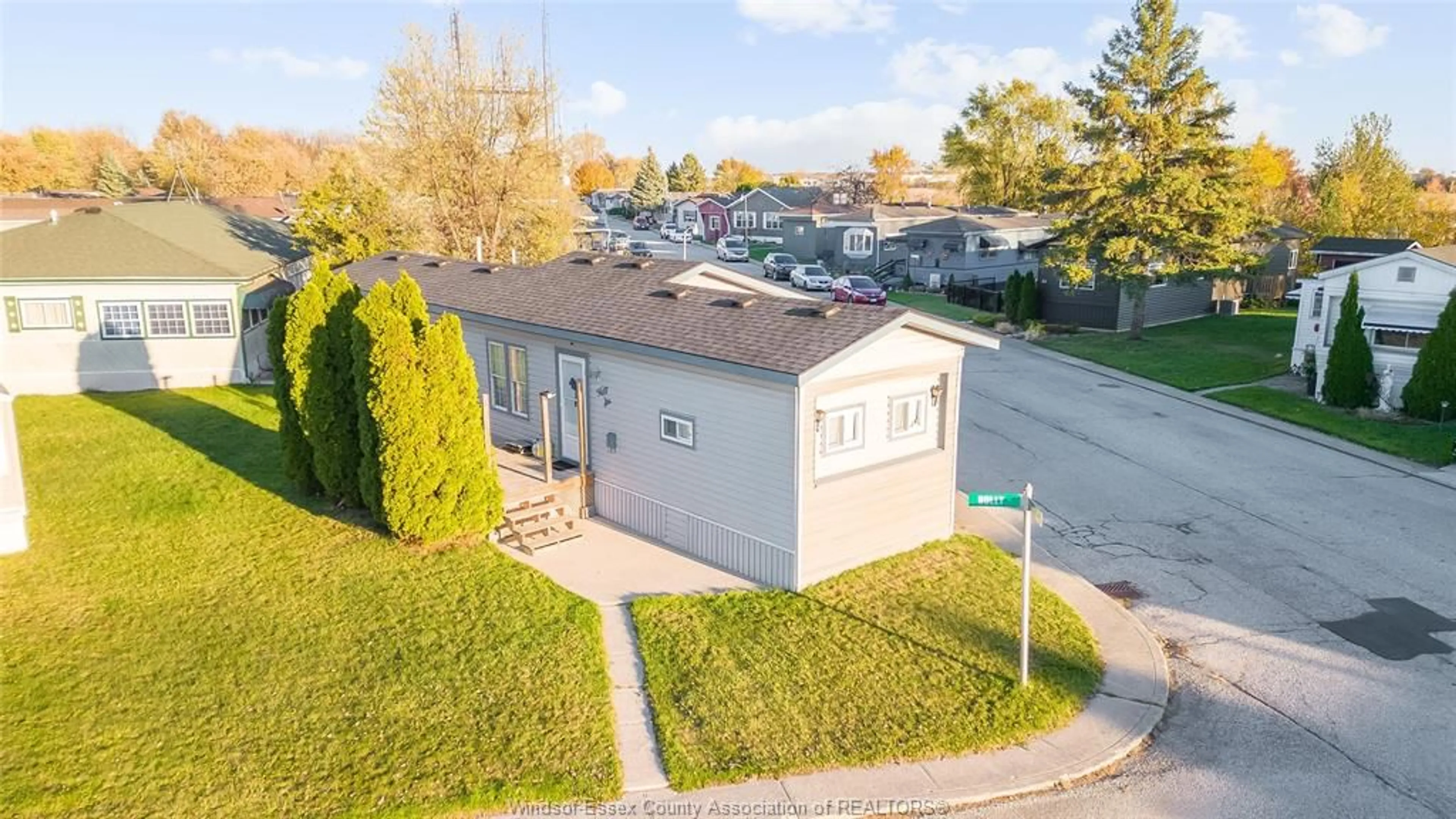 A pic from outside/outdoor area/front of a property/back of a property/a pic from drone, street for 56 HOLLY St, Lakeshore Ontario N8N 2V1
