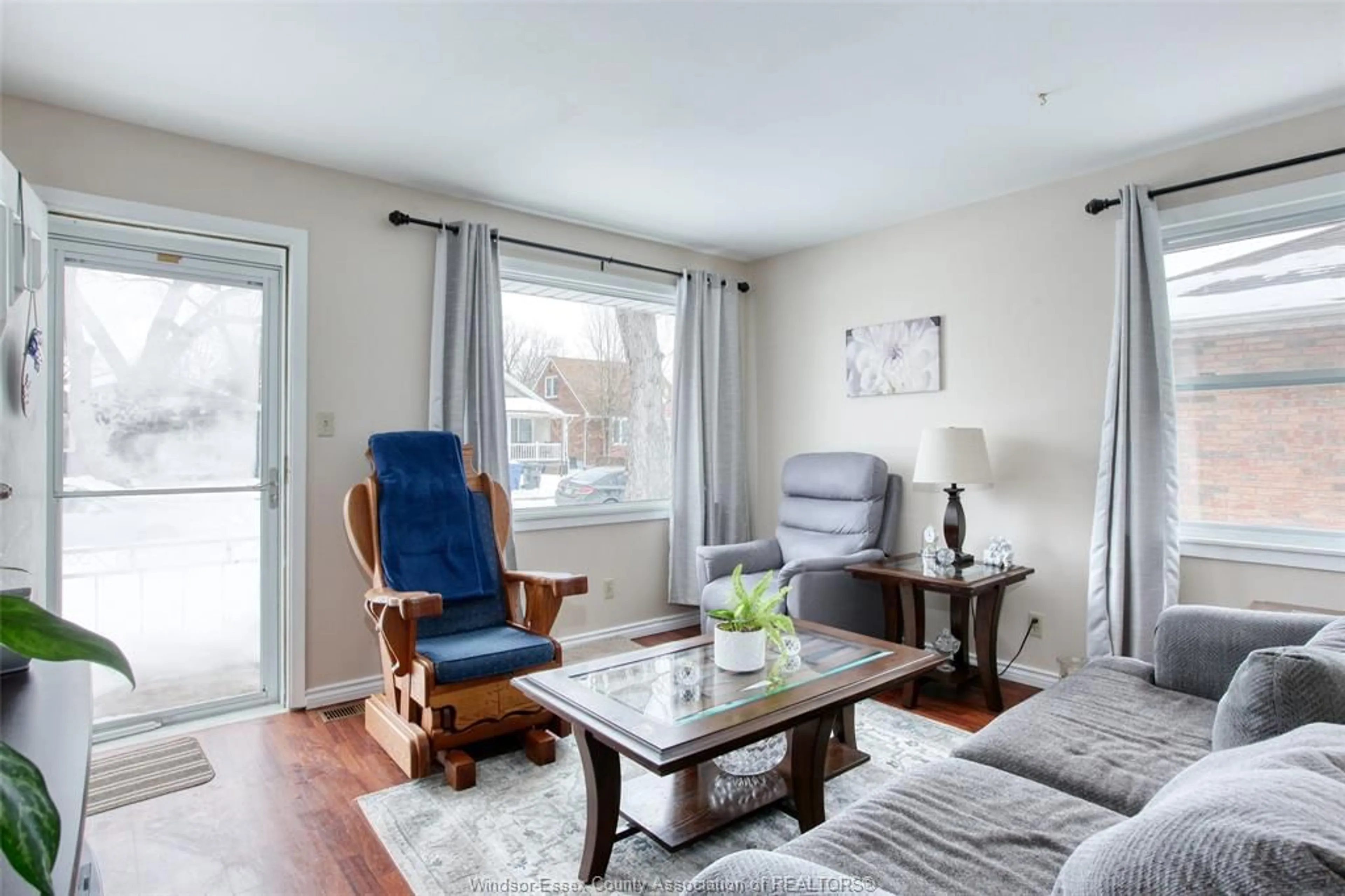 Living room with furniture, wood/laminate floor for 1067 ST. LOUIS, Windsor Ontario N8S 2K9