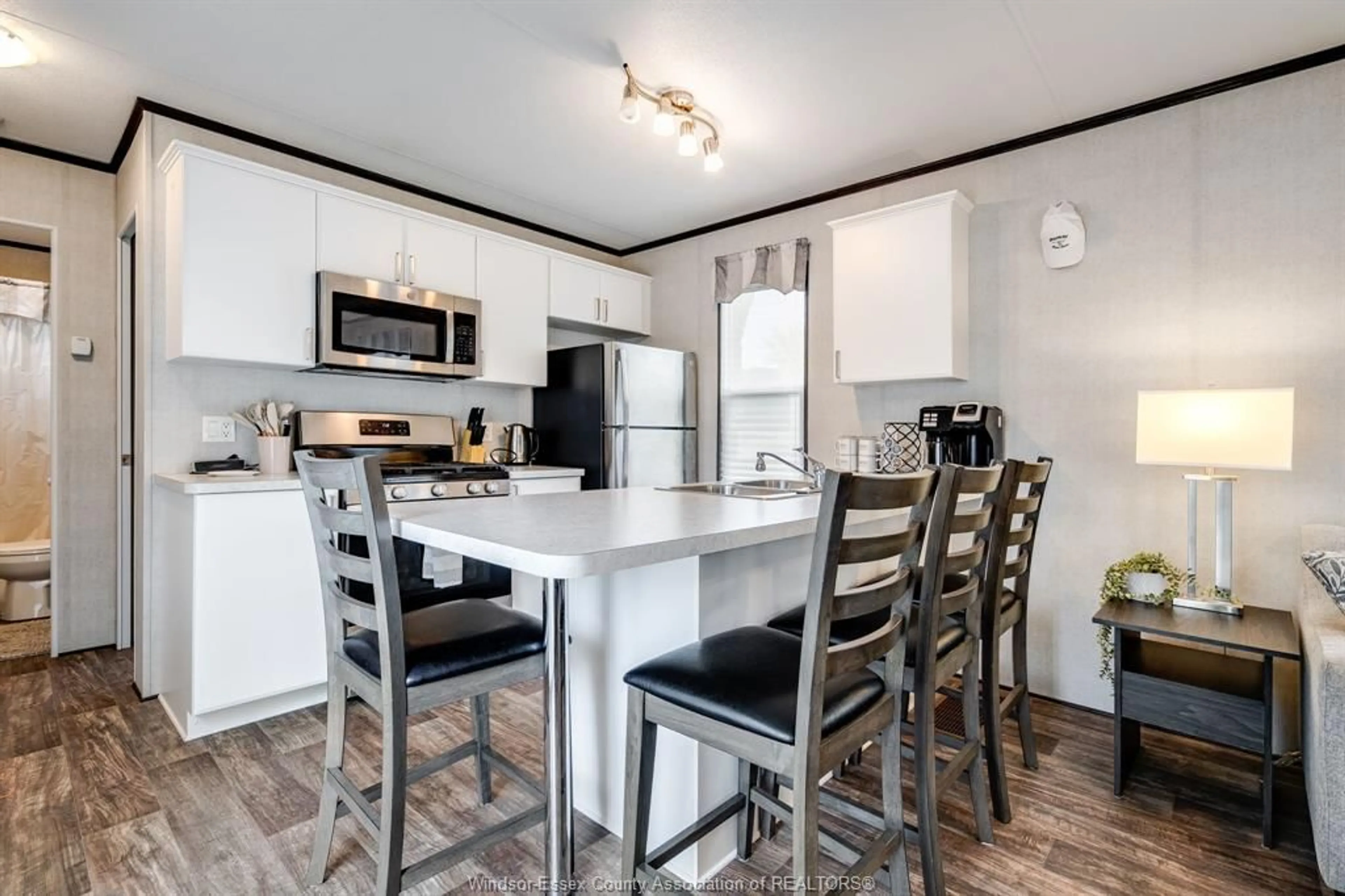 Open concept kitchen, wood/laminate floor for 981 County Rd 2 #522, Lakeshore Ontario N8N 4P4