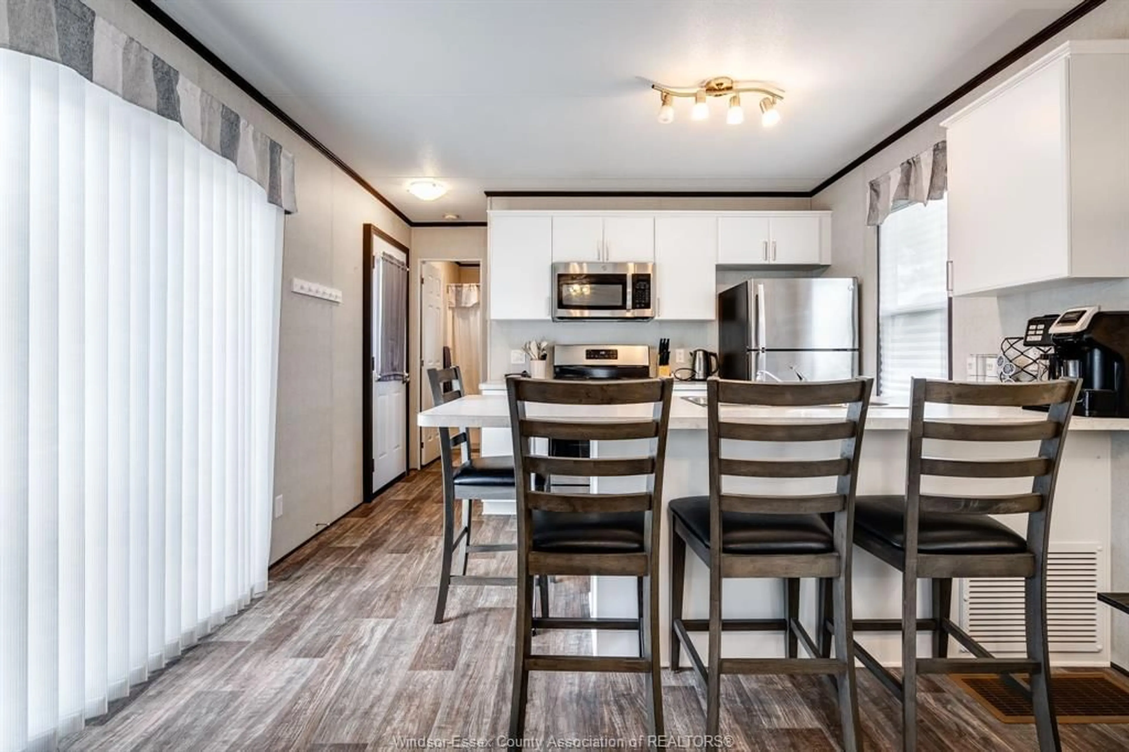 Open concept kitchen, wood/laminate floor for 981 County Rd 2 #522, Lakeshore Ontario N8N 4P4