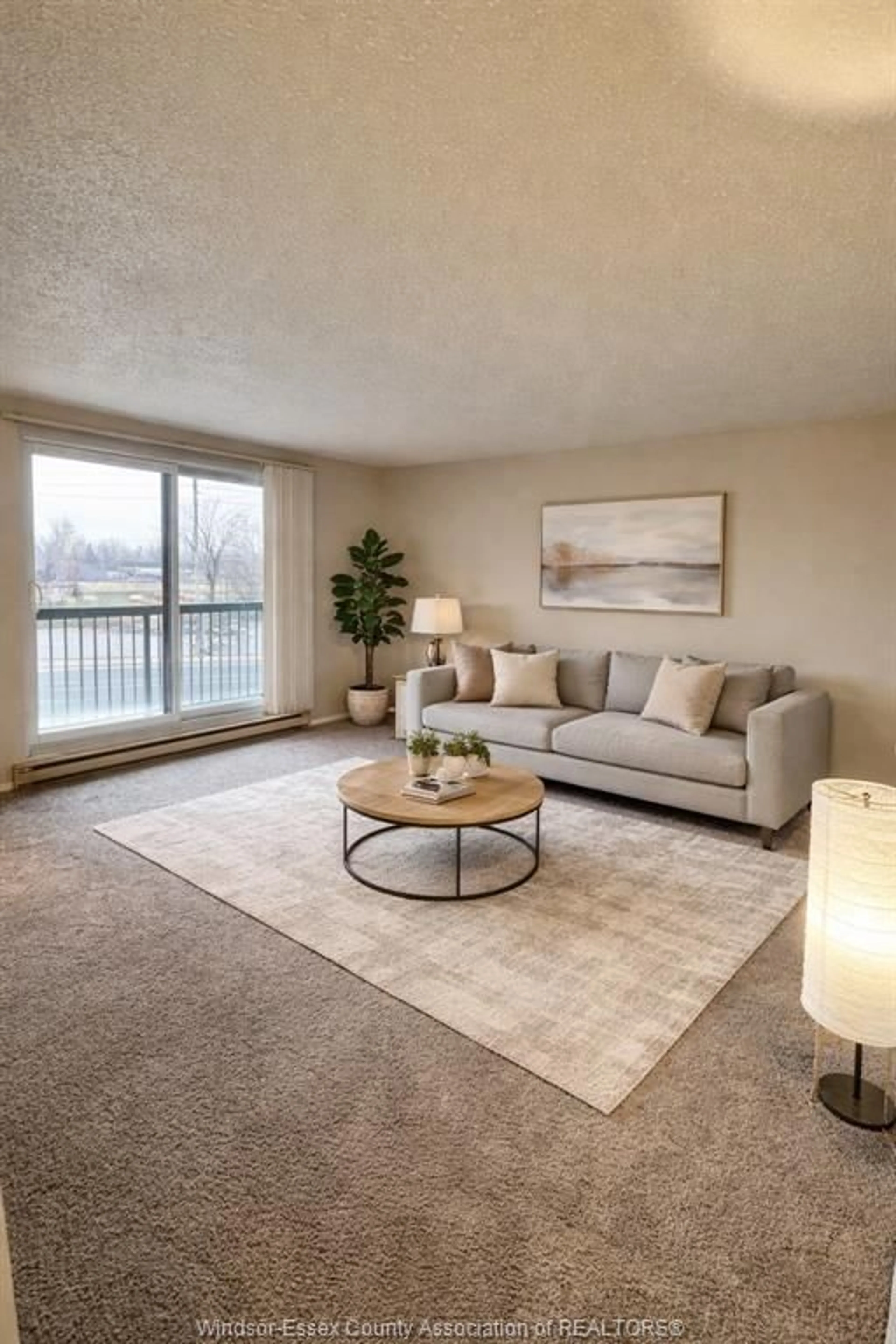 Living room with furniture, carpet floor for 3936 WYANDOTTE St #312, Windsor Ontario N8Y 4V1