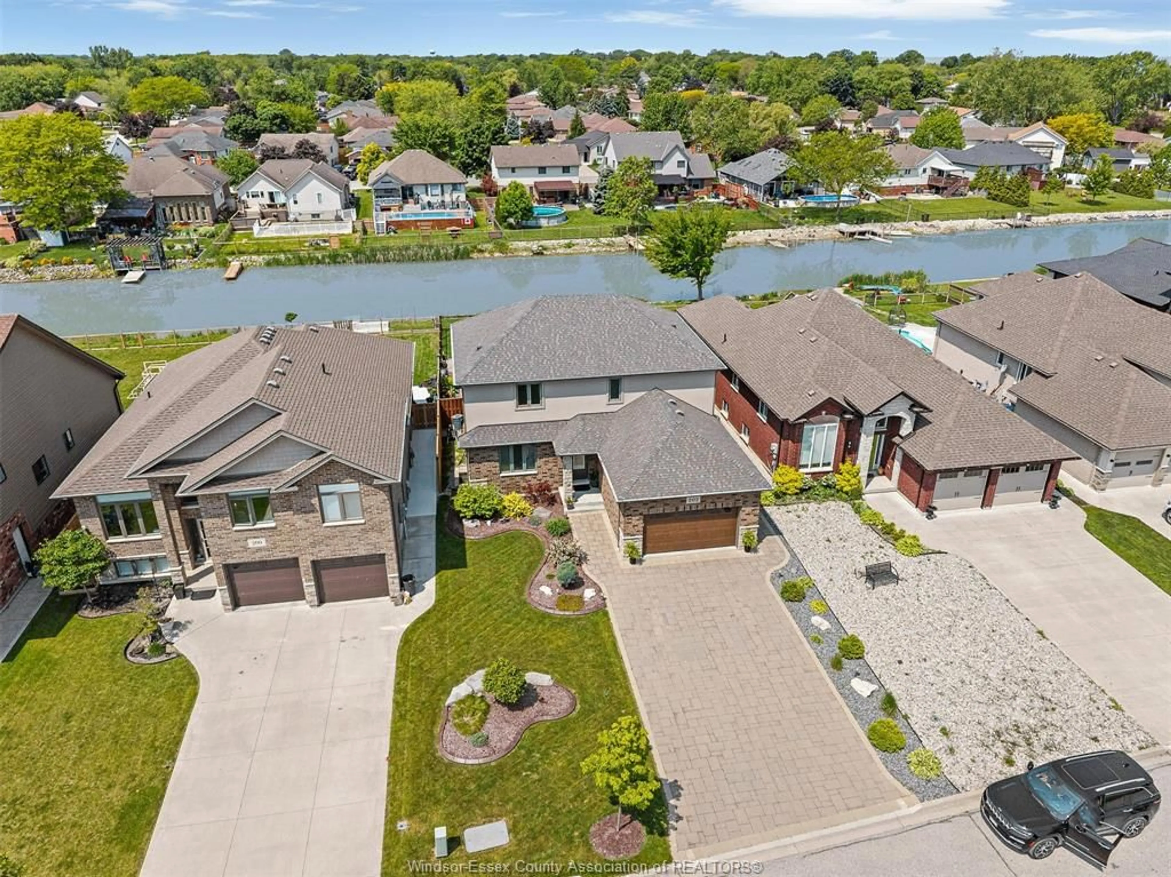 A pic from outside/outdoor area/front of a property/back of a property/a pic from drone, water/lake/river/ocean view for 202 SUMMER St, Lakeshore Ontario N8L 0G6