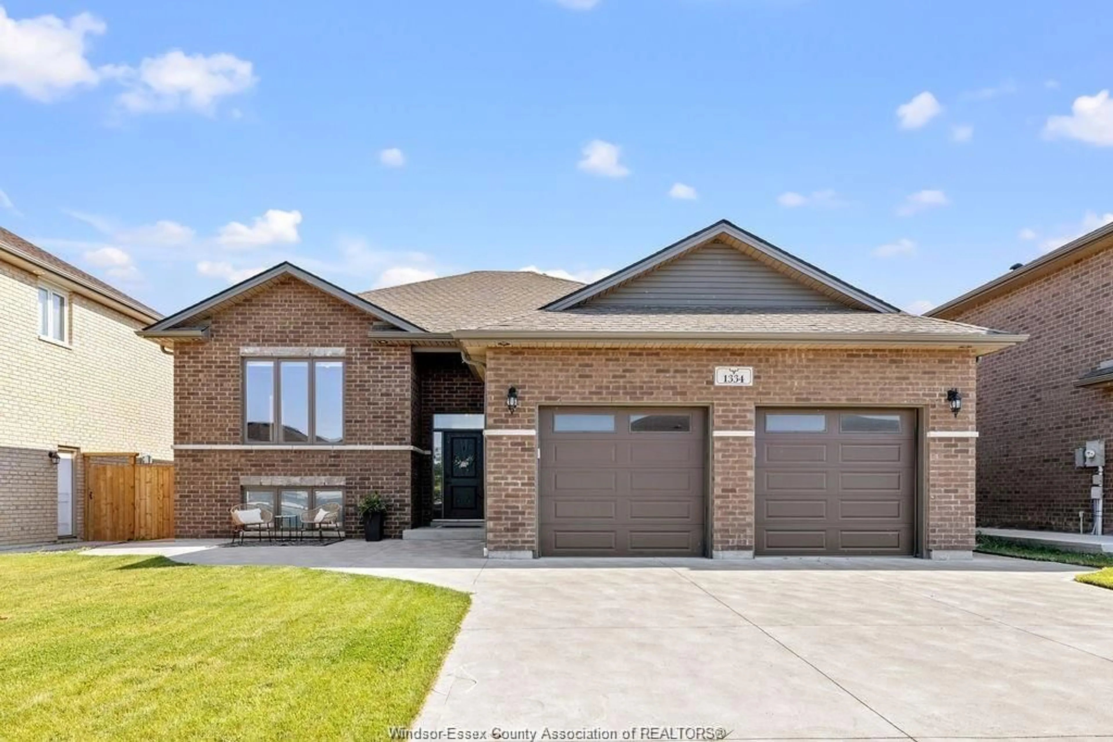 Home with brick exterior material, street for 1334 Deer Run Trail, Lakeshore Ontario N0R 1A0