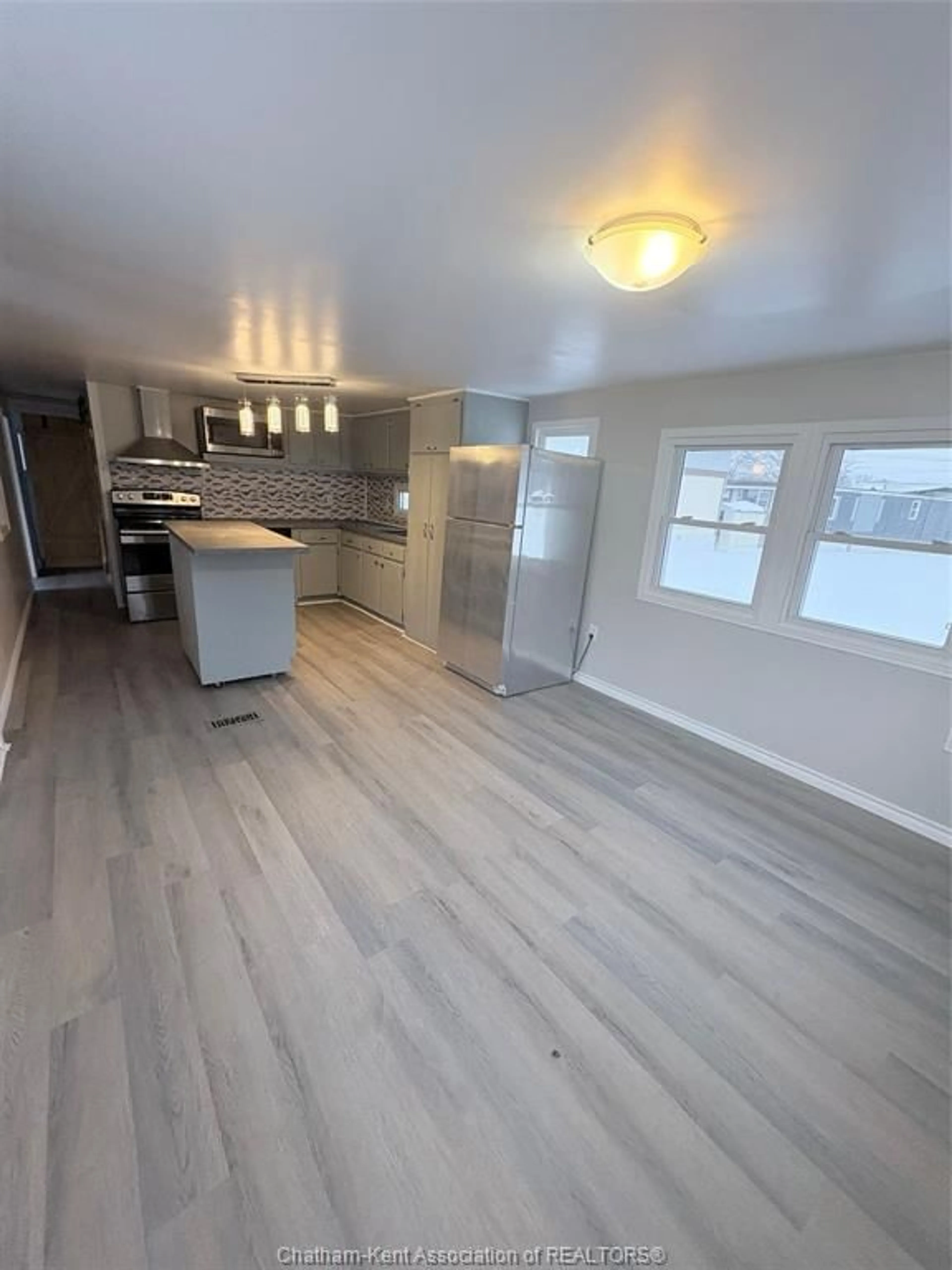 Open concept kitchen, wood/laminate floor for 9480 LONGWOODS Rd #48, Chatham-Kent Ontario N7M 5J7
