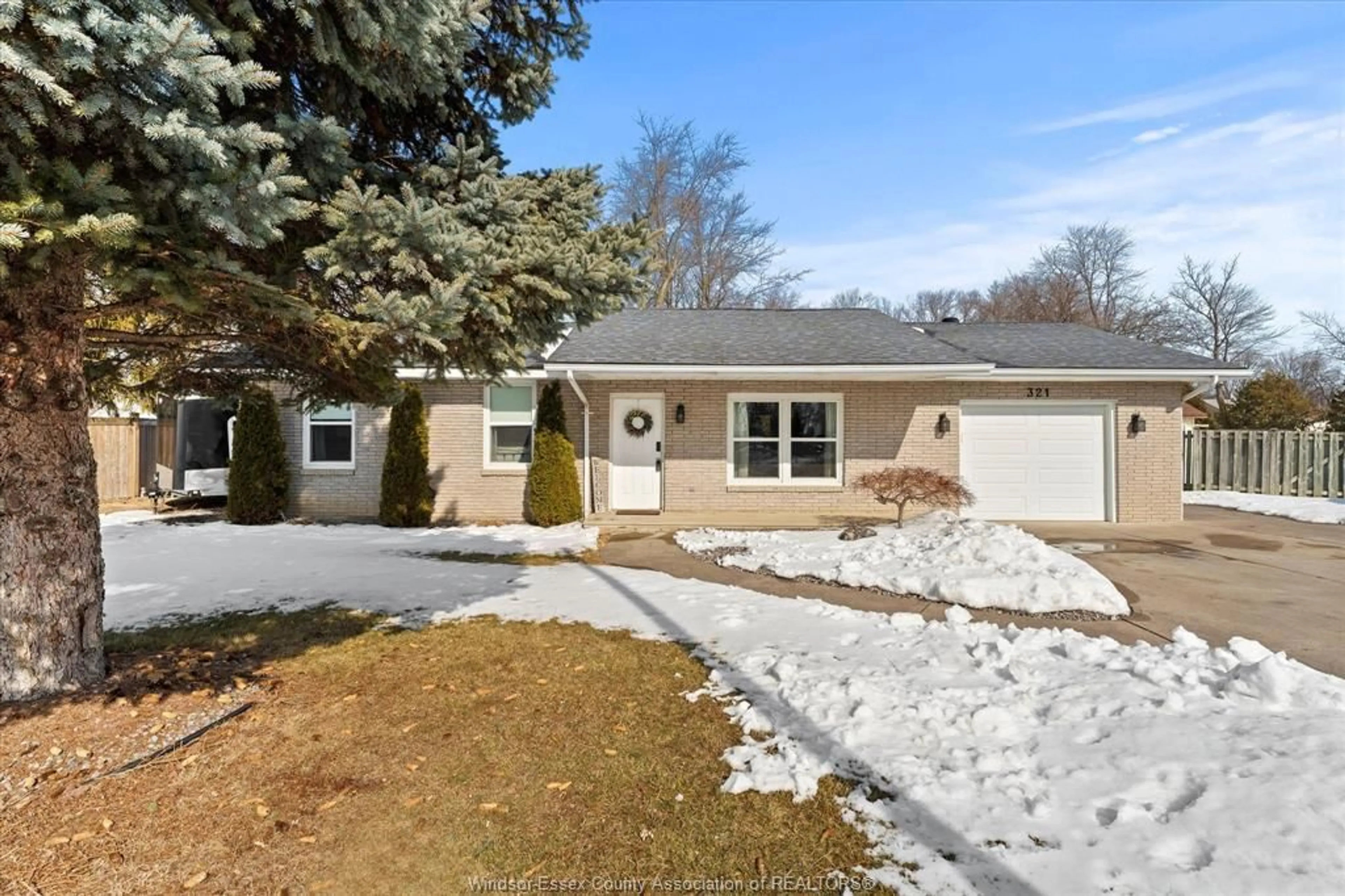 Home with vinyl exterior material, street for 321 Cartier, Belle River Ontario N8L 0N2