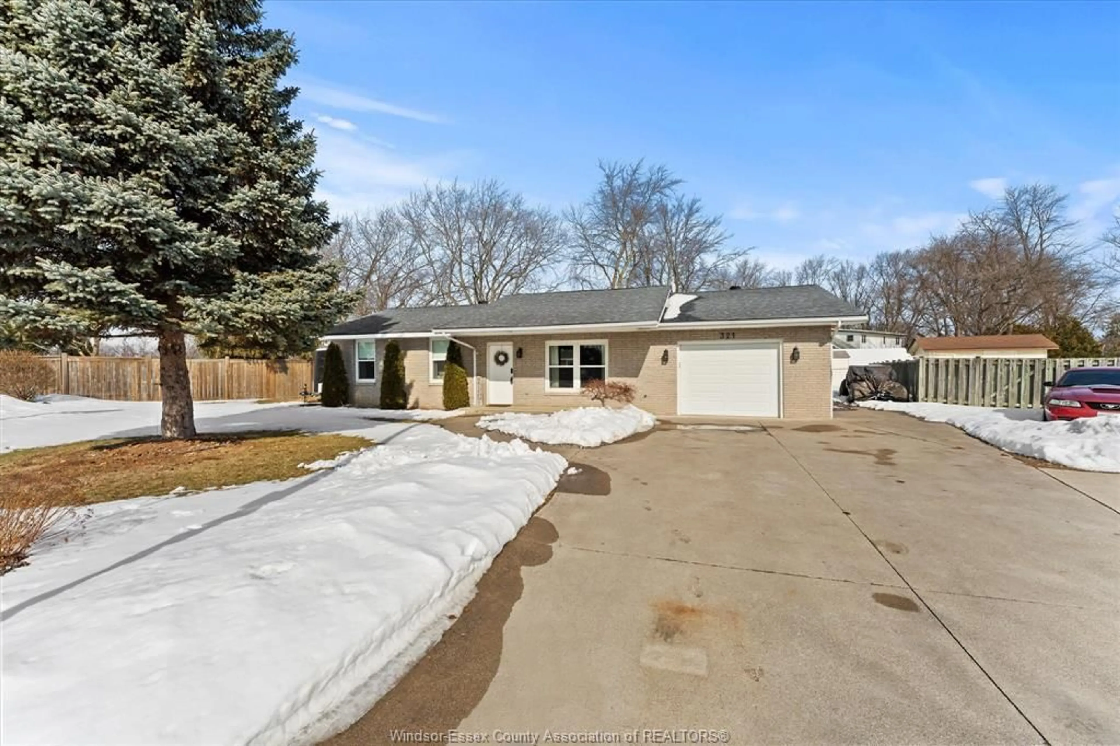 A pic from outside/outdoor area/front of a property/back of a property/a pic from drone, street for 321 Cartier, Belle River Ontario N8L 0N2