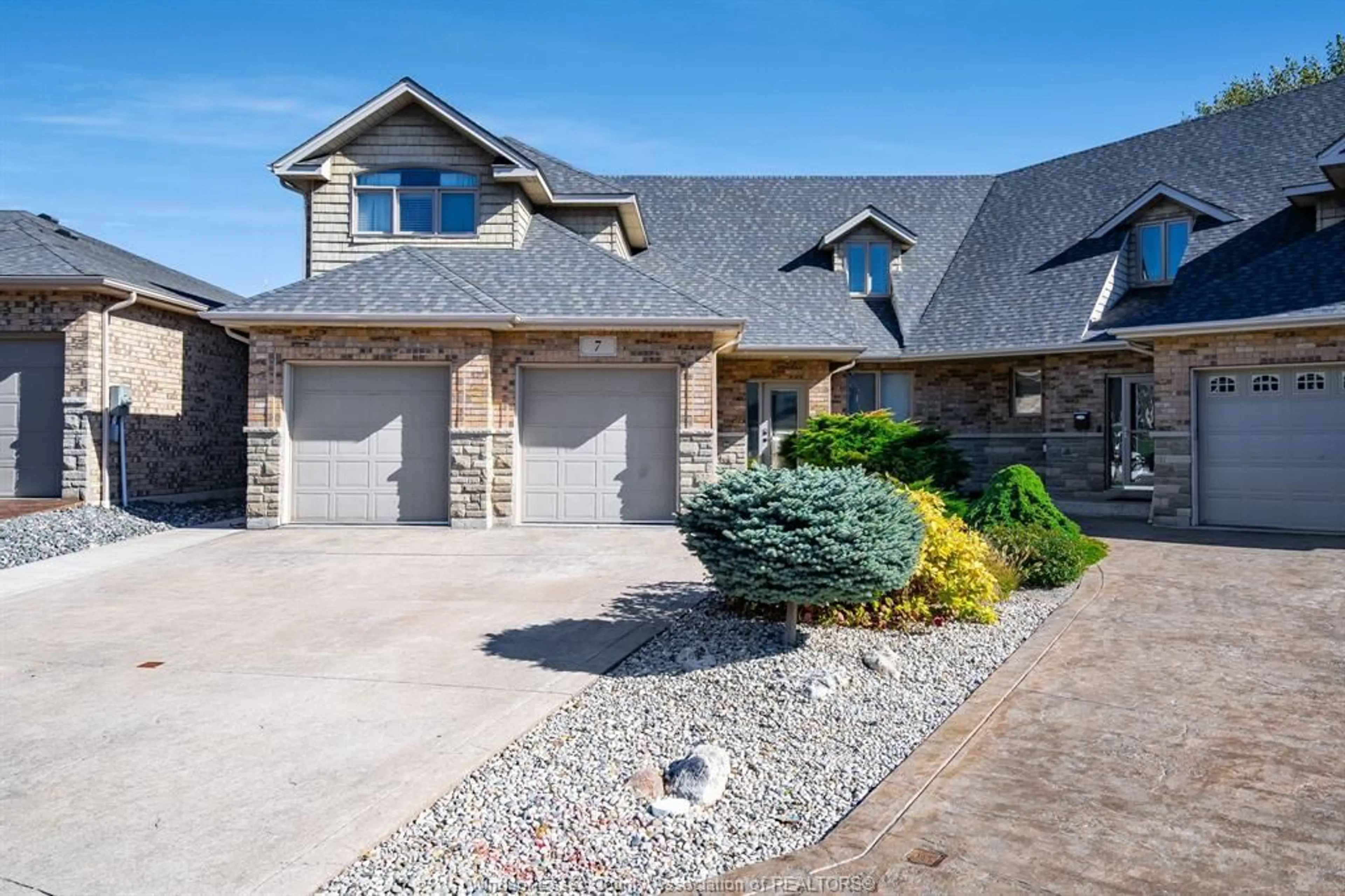 Home with brick exterior material, street for 7 Mettawas Lane, Kingsville Ontario N9Y 0A2