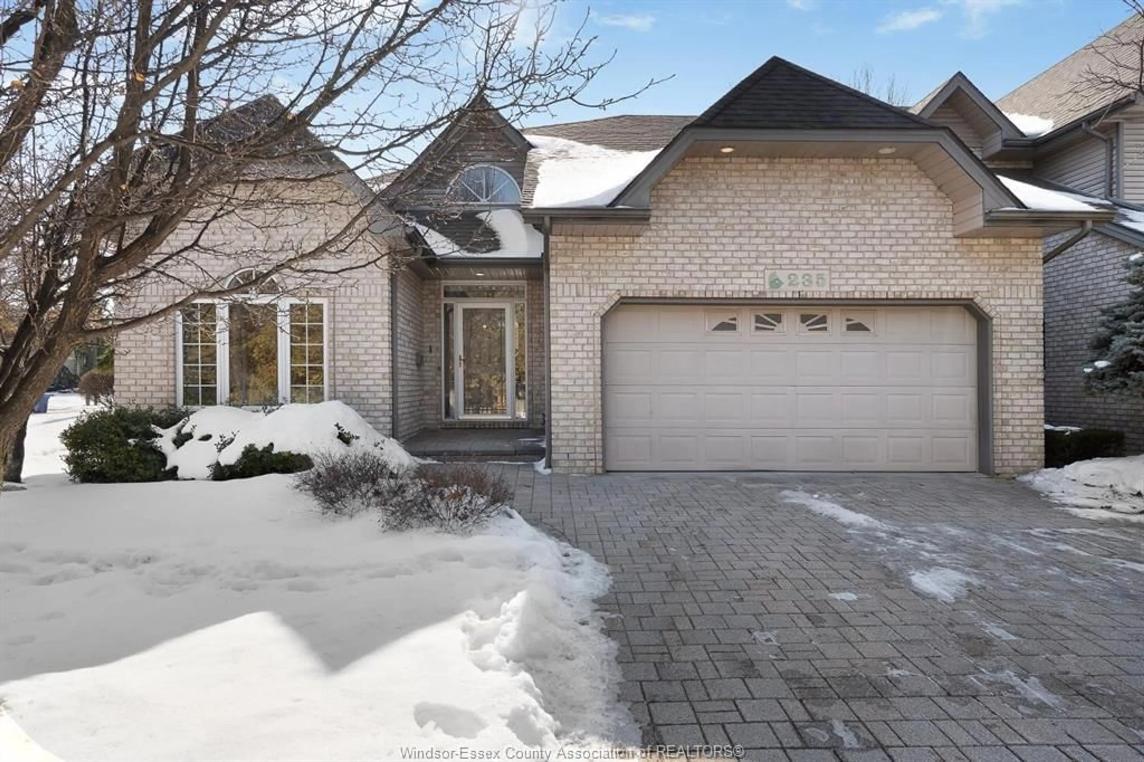 Home with brick exterior material, street for 235 SOUTHWIND Cres, Tecumseh Ontario N8N 4Y5