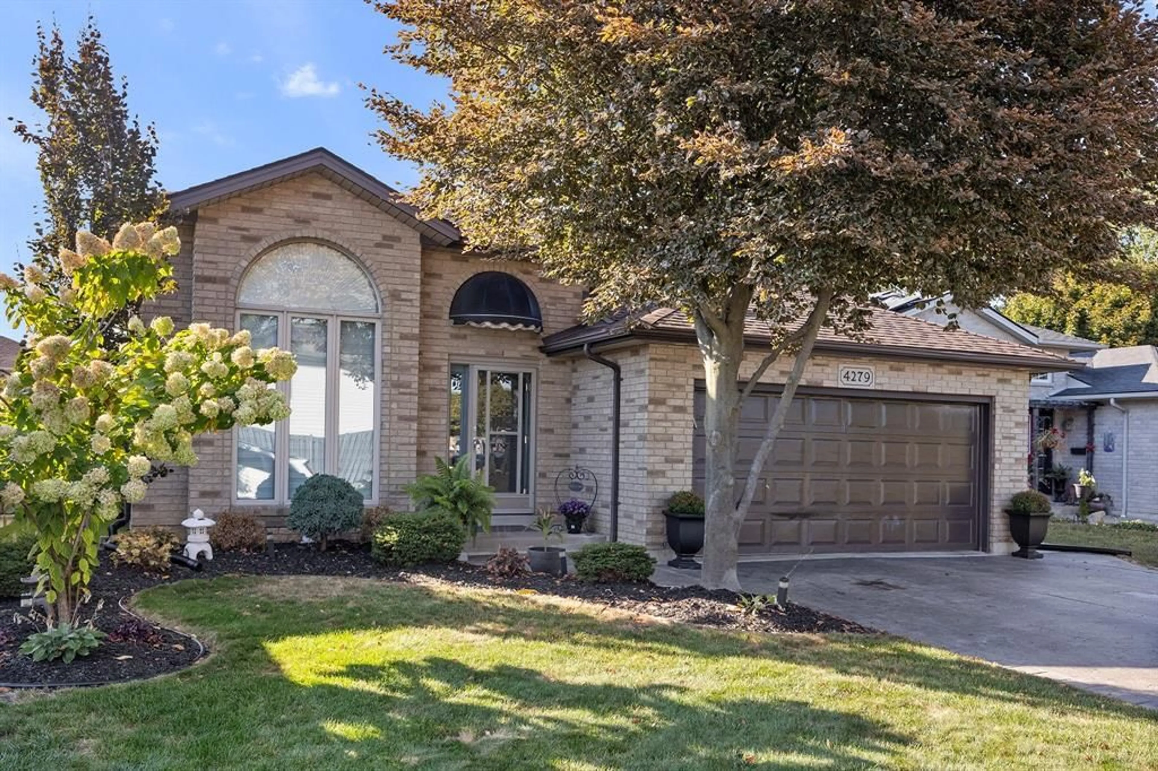Home with brick exterior material, street for 4279 MARLO Cres, Windsor Ontario N9G 2Y6