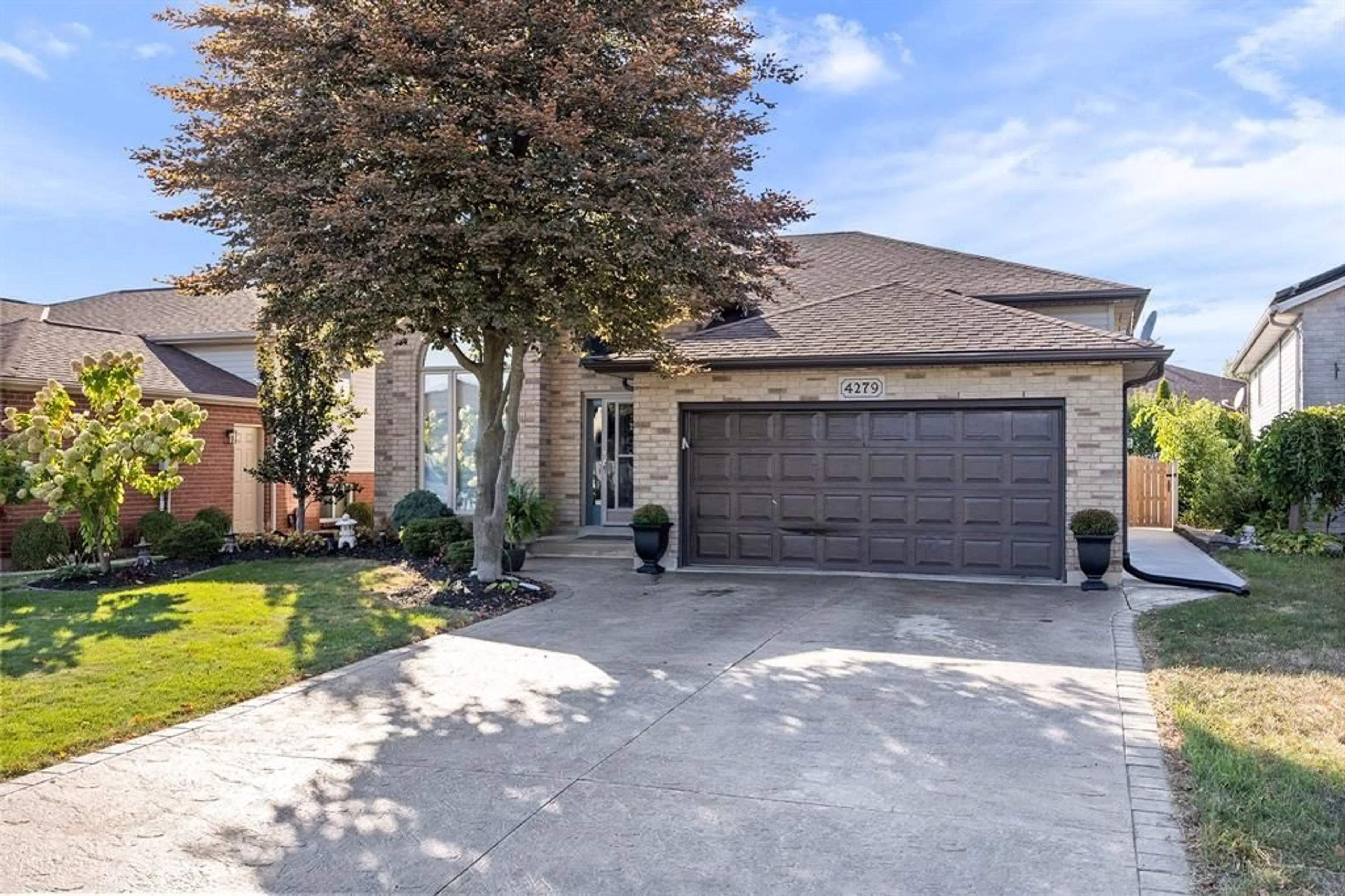 Home with brick exterior material, street for 4279 MARLO Cres, Windsor Ontario N9G 2Y6