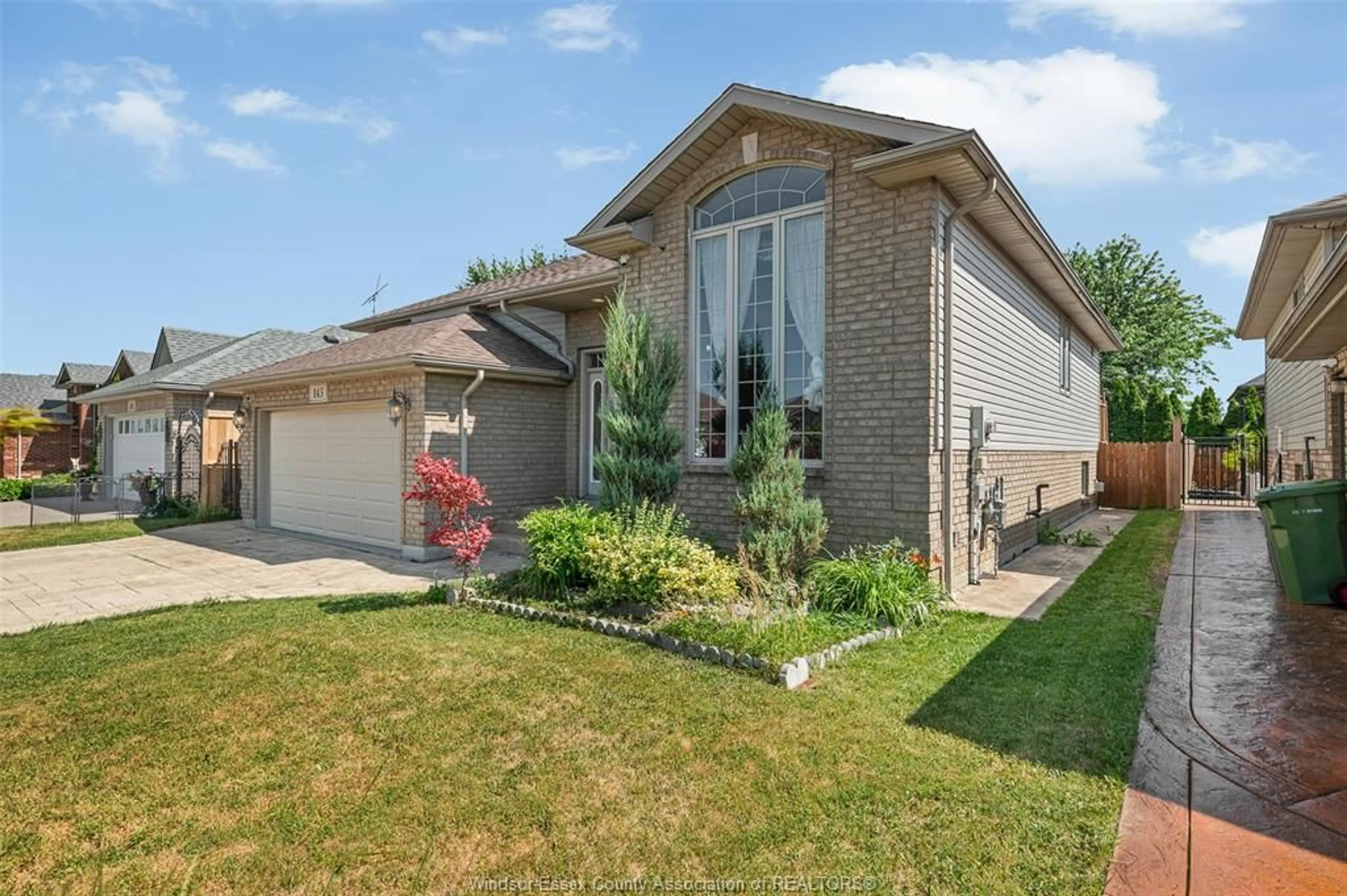 Home with brick exterior material, street for 143 AMY CROFT, Lakeshore Ontario N9K 1E6