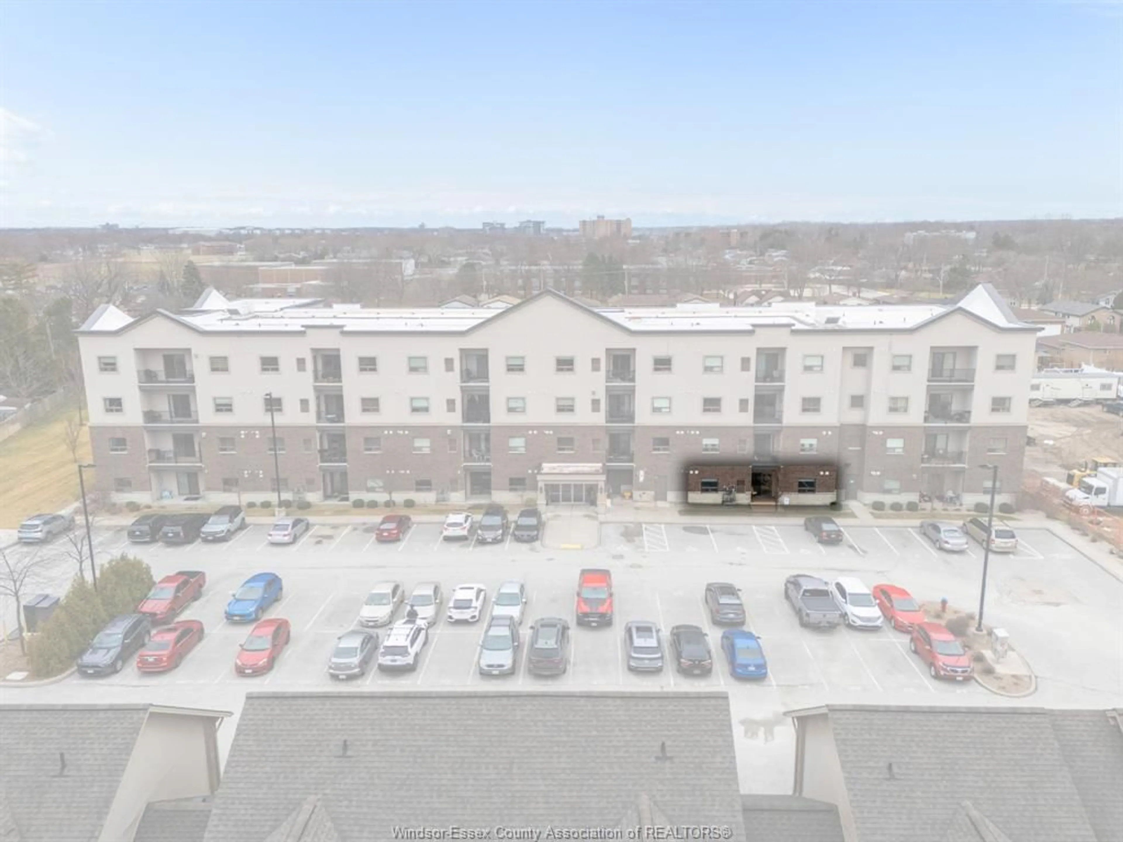 A pic from outside/outdoor area/front of a property/back of a property/a pic from drone, unknown for 8475 Wyandotte St #111, Windsor Ontario N8S 0A4