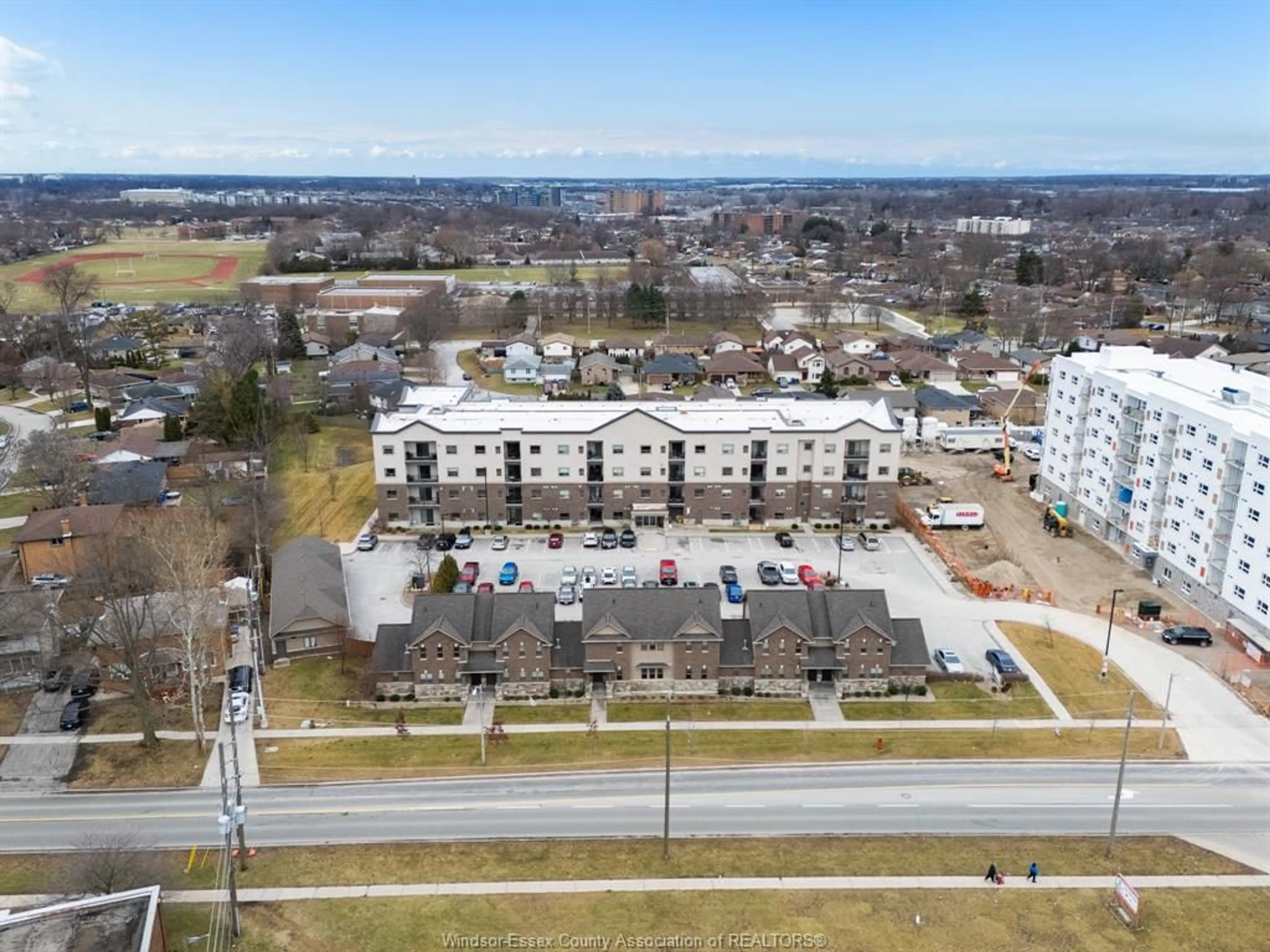 A pic from outside/outdoor area/front of a property/back of a property/a pic from drone, unknown for 8475 Wyandotte St #111, Windsor Ontario N8S 0A4