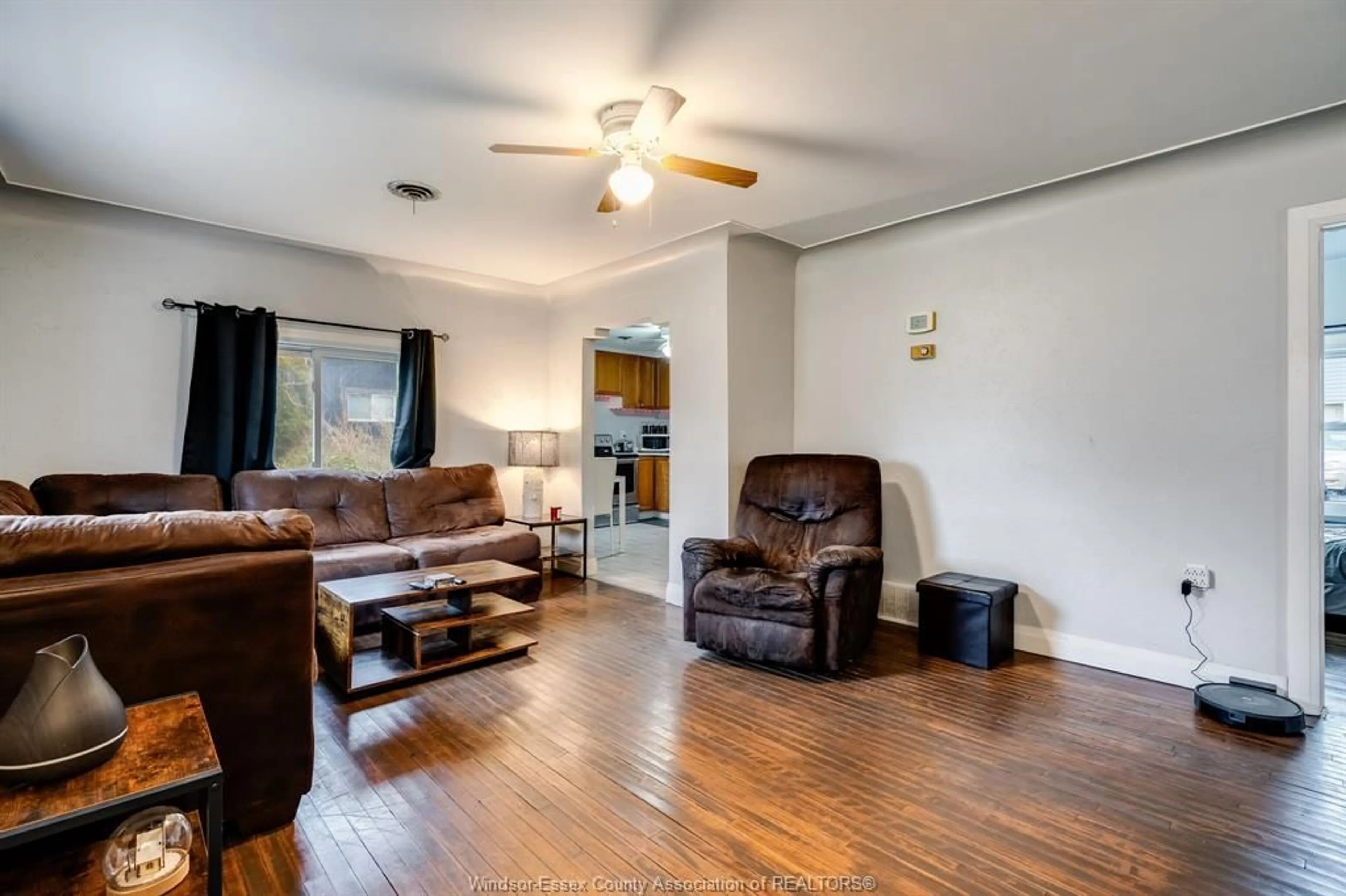 Living room with furniture, wood/laminate floor for 672 Talbot Rd, Maidstone Ontario N0R 1K0