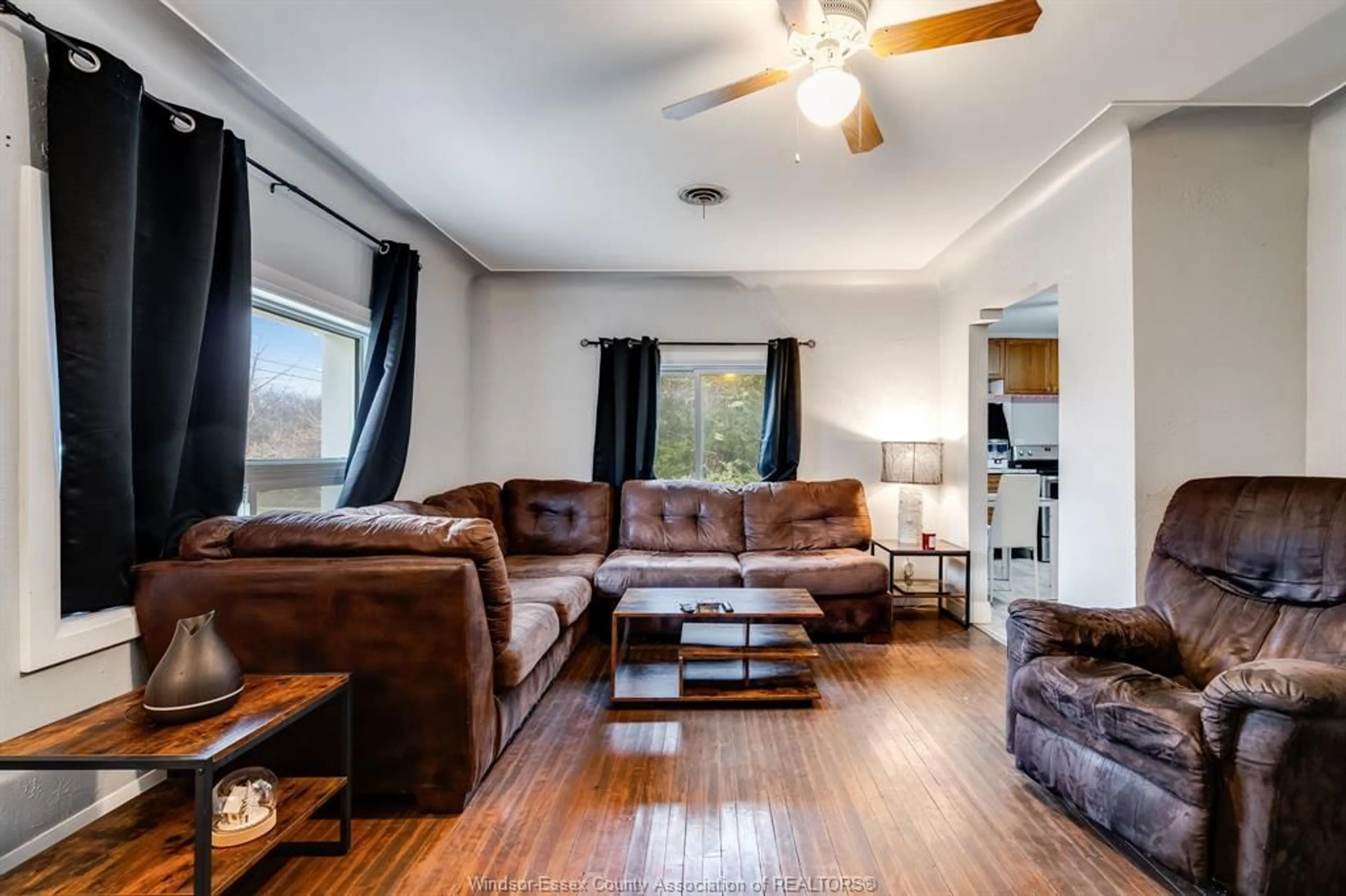 Living room with furniture, wood/laminate floor for 672 Talbot Rd, Maidstone Ontario N0R 1K0