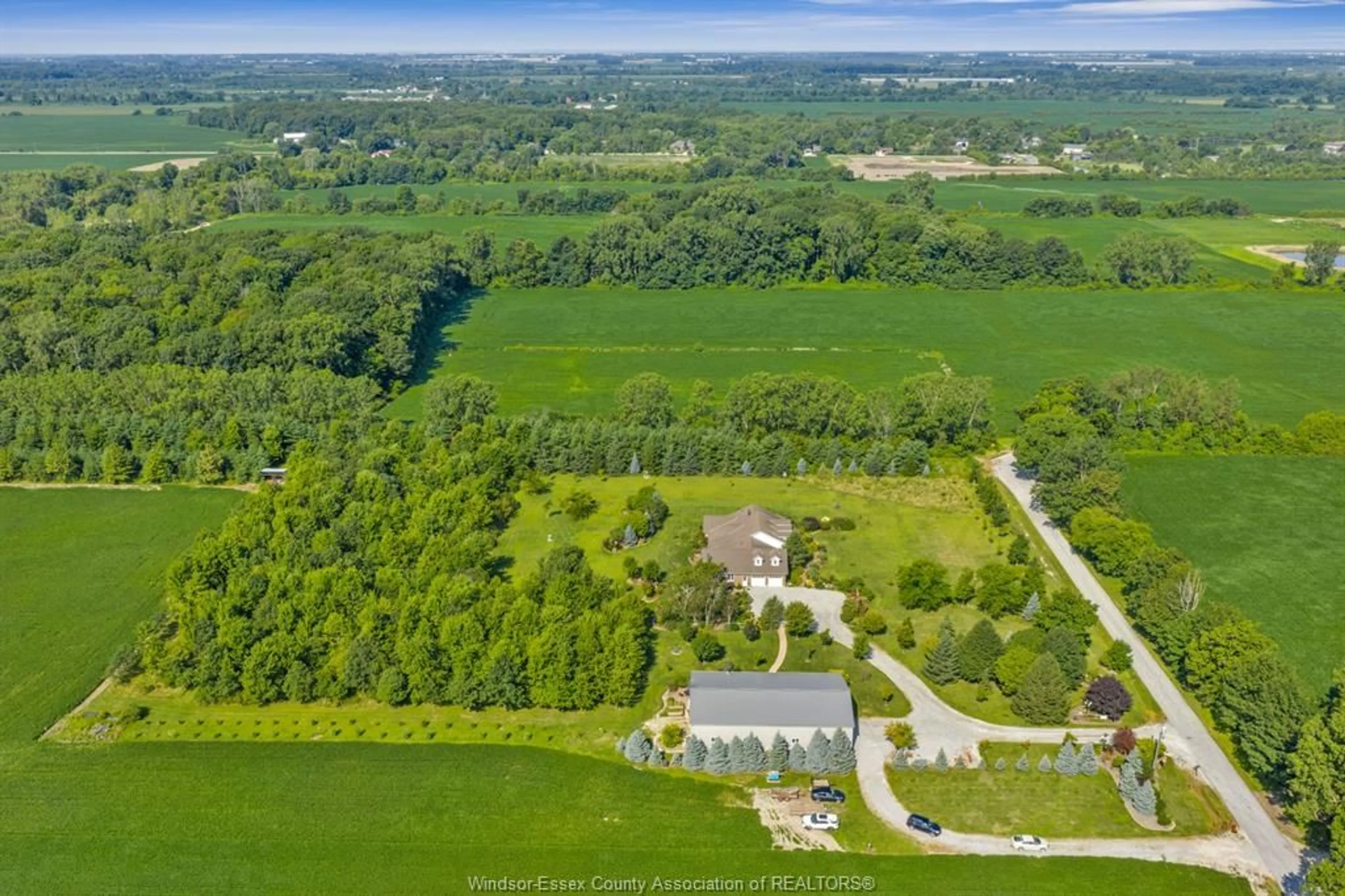 A pic from outside/outdoor area/front of a property/back of a property/a pic from drone, forest/trees view for 2310 Hickson Rd., Leamington Ontario N0P 2P0