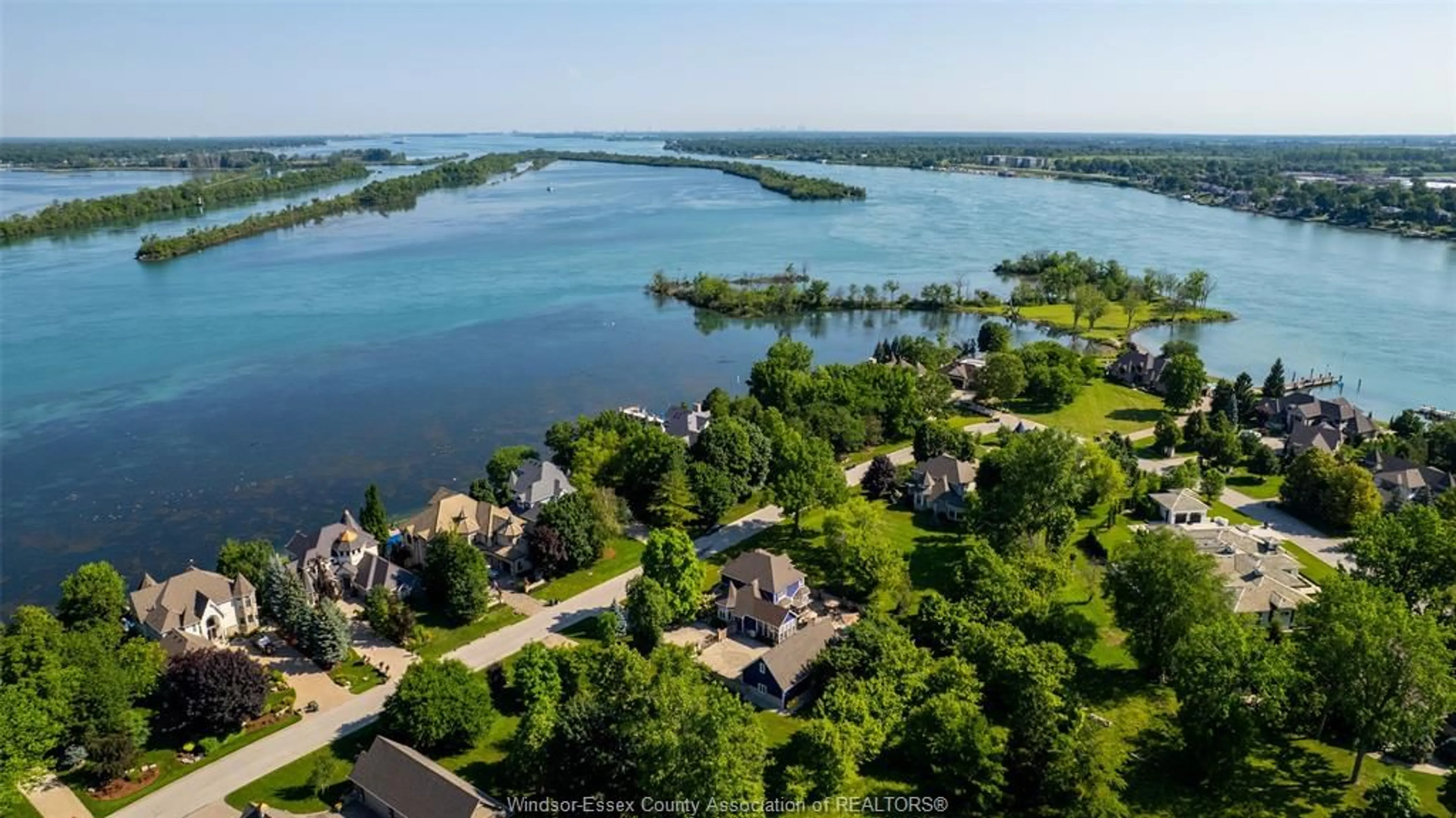 A pic from outside/outdoor area/front of a property/back of a property/a pic from drone, water/lake/river/ocean view for 399 Crystal Bay Dr, Amherstburg Ontario N9V 4A7