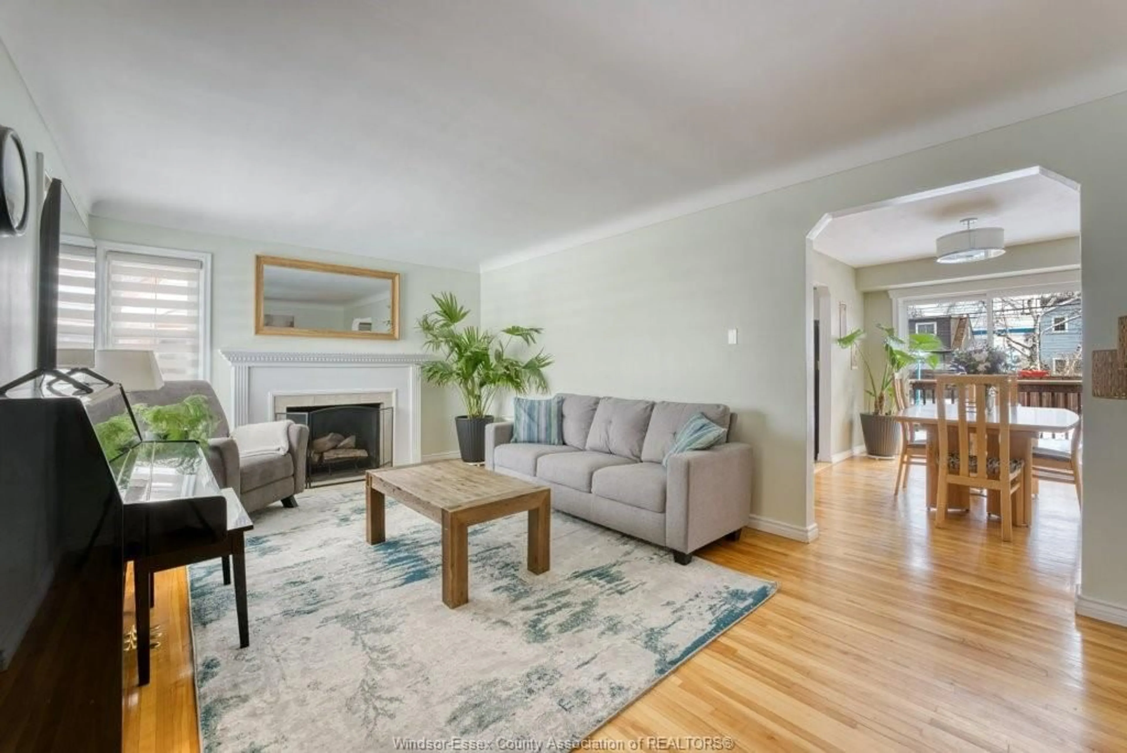 Living room with furniture, wood/laminate floor for 2580 Byng Rd, Windsor Ontario N8W 3E9