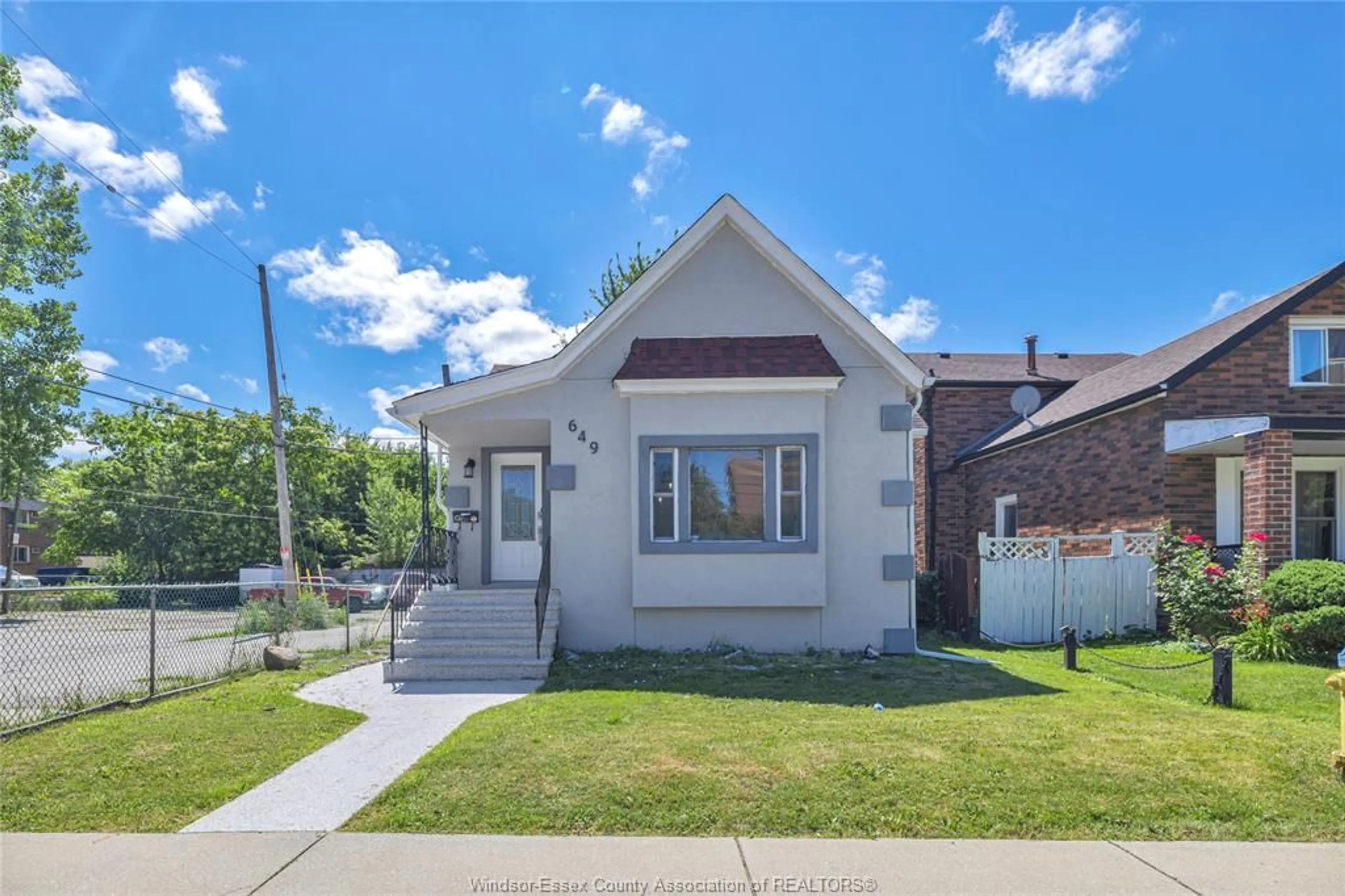 Home with brick exterior material, street for 649 CATARAQUI, Windsor Ontario N9V 3P2
