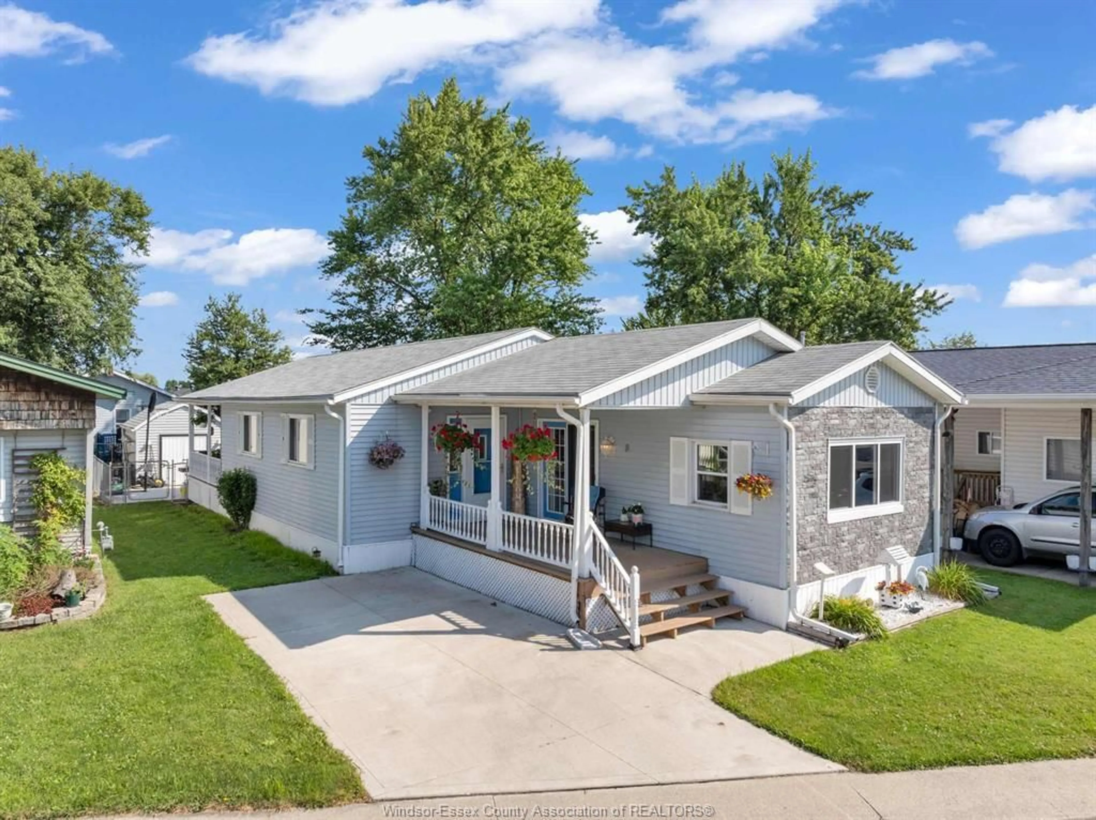 Home with vinyl exterior material, street for 8 Maple, McGregor Ontario N0R 1J0