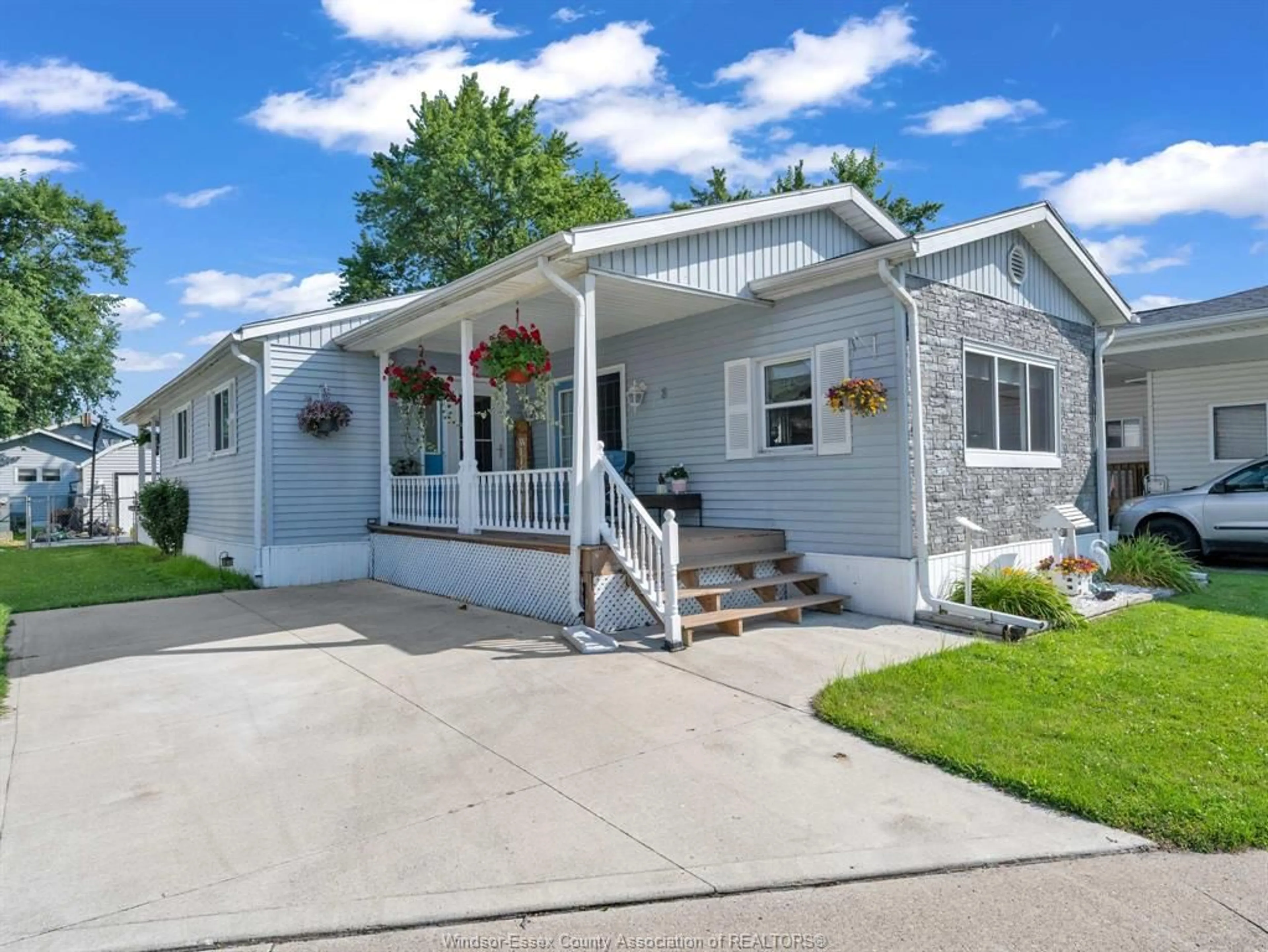 Home with vinyl exterior material, street for 8 Maple, McGregor Ontario N0R 1J0