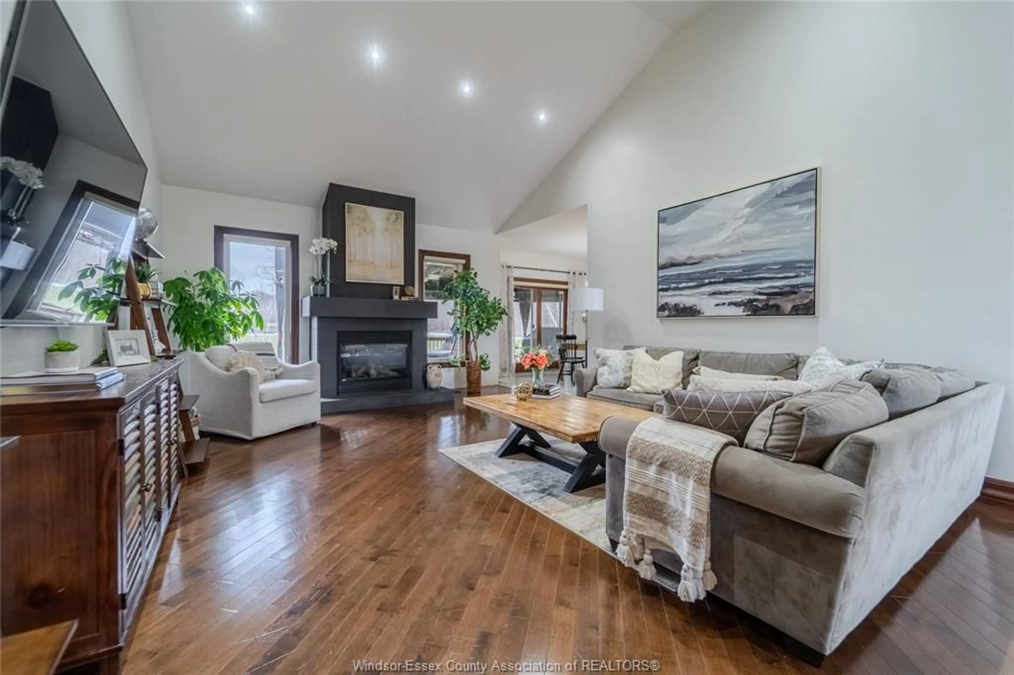 Living room with furniture, wood/laminate floor for 1291 Lyoness Crt, LaSalle Ontario N9J 3Y5