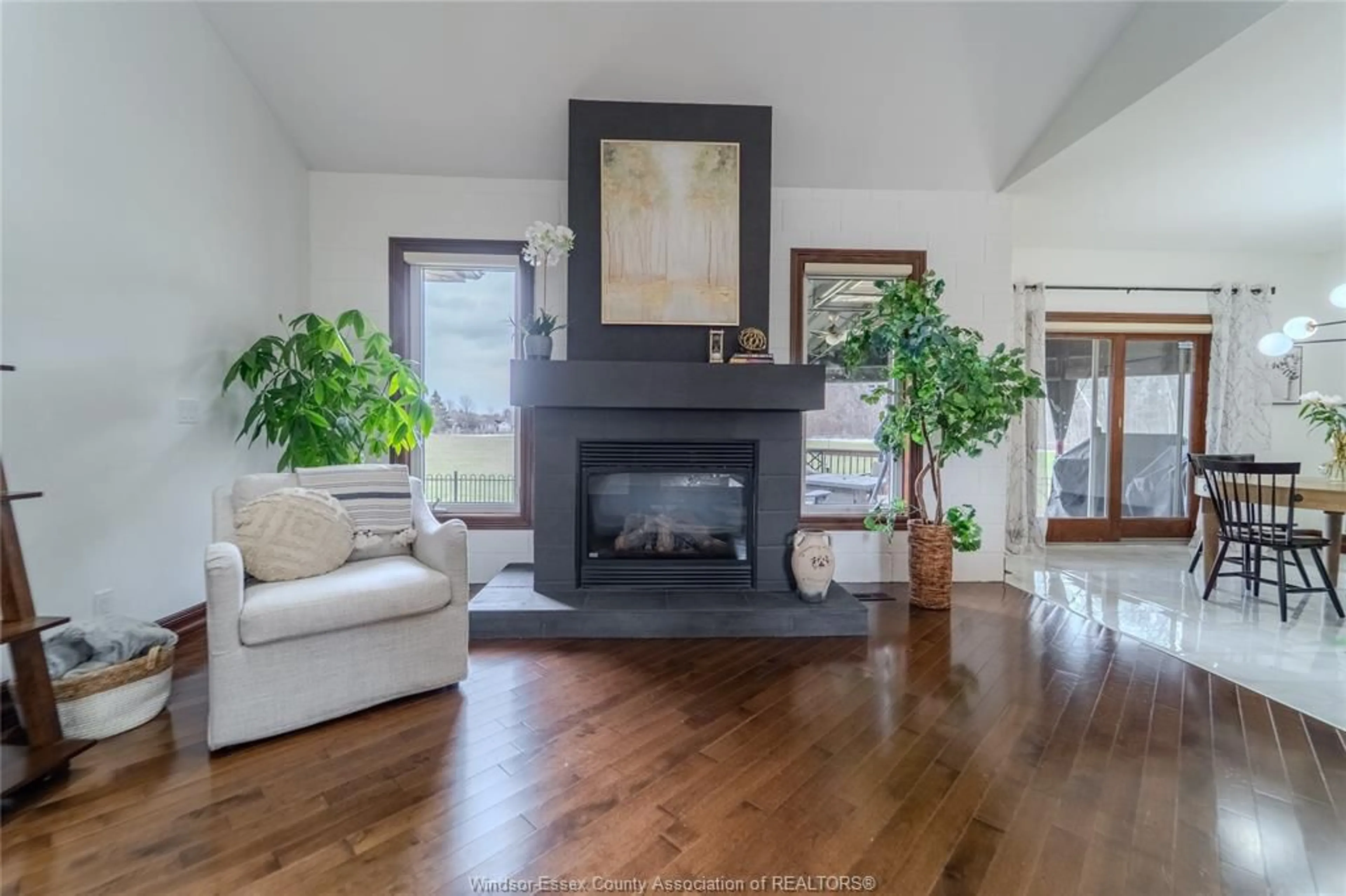 Living room with furniture, wood/laminate floor for 1291 Lyoness Crt, LaSalle Ontario N9J 3Y5