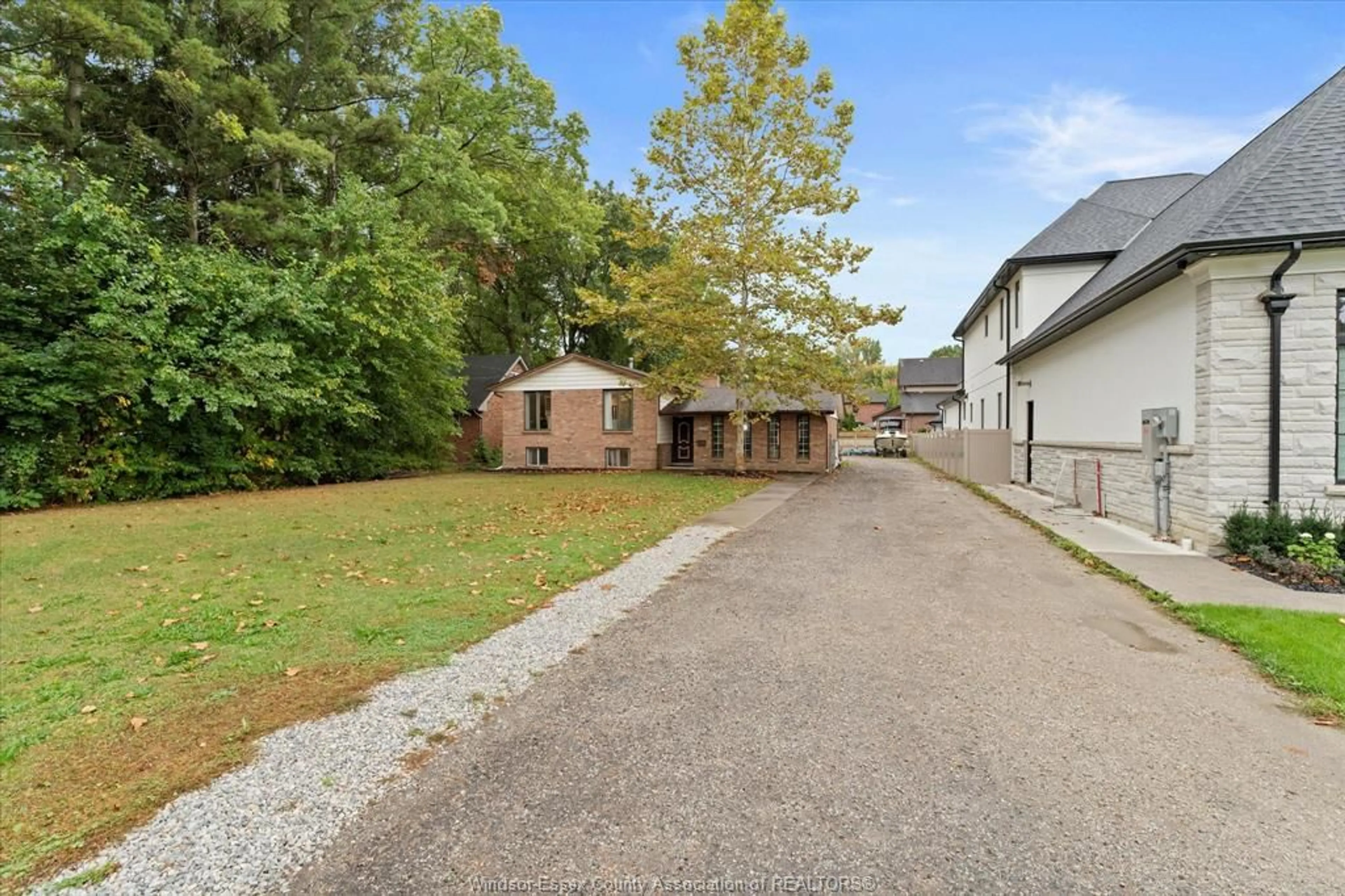 A pic from outside/outdoor area/front of a property/back of a property/a pic from drone, street for 1222 REAUME Rd, LaSalle Ontario N9J 1C1