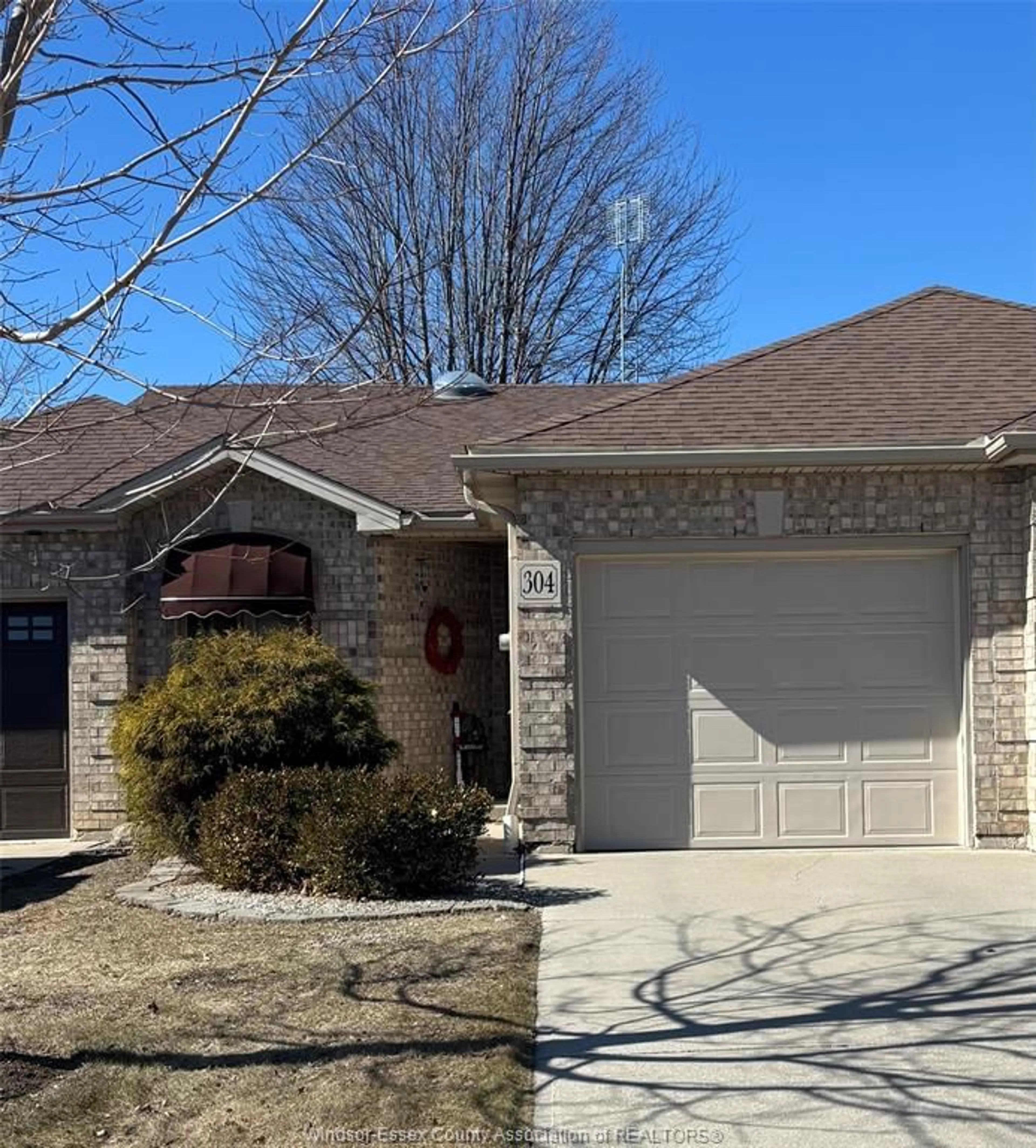 Home with brick exterior material, street for 304 Rockport Lane, Kingsville Ontario N9Y 4A4