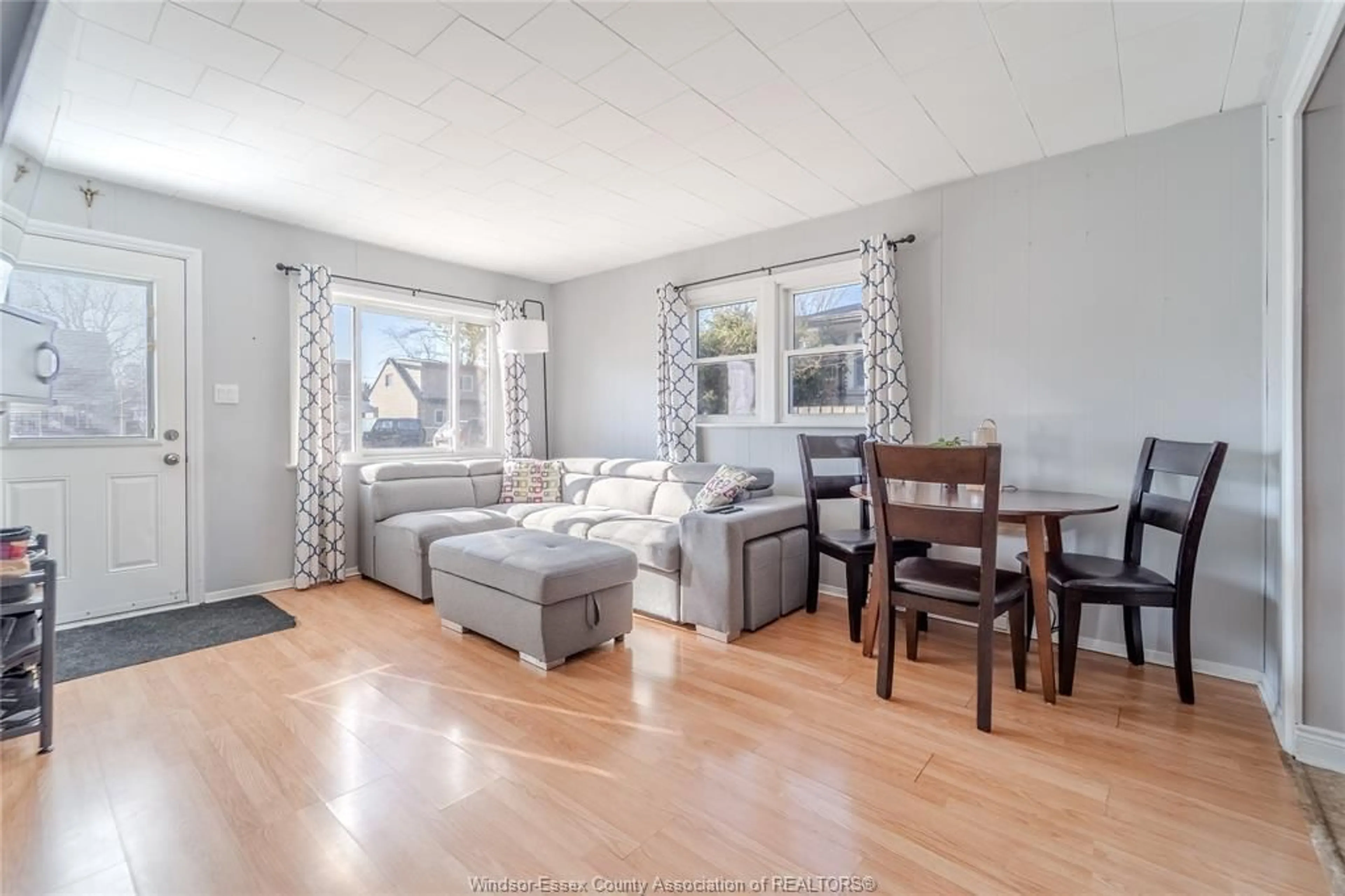 Living room with furniture, wood/laminate floor for 720 Vanier St, Windsor Ontario N8X 3E6