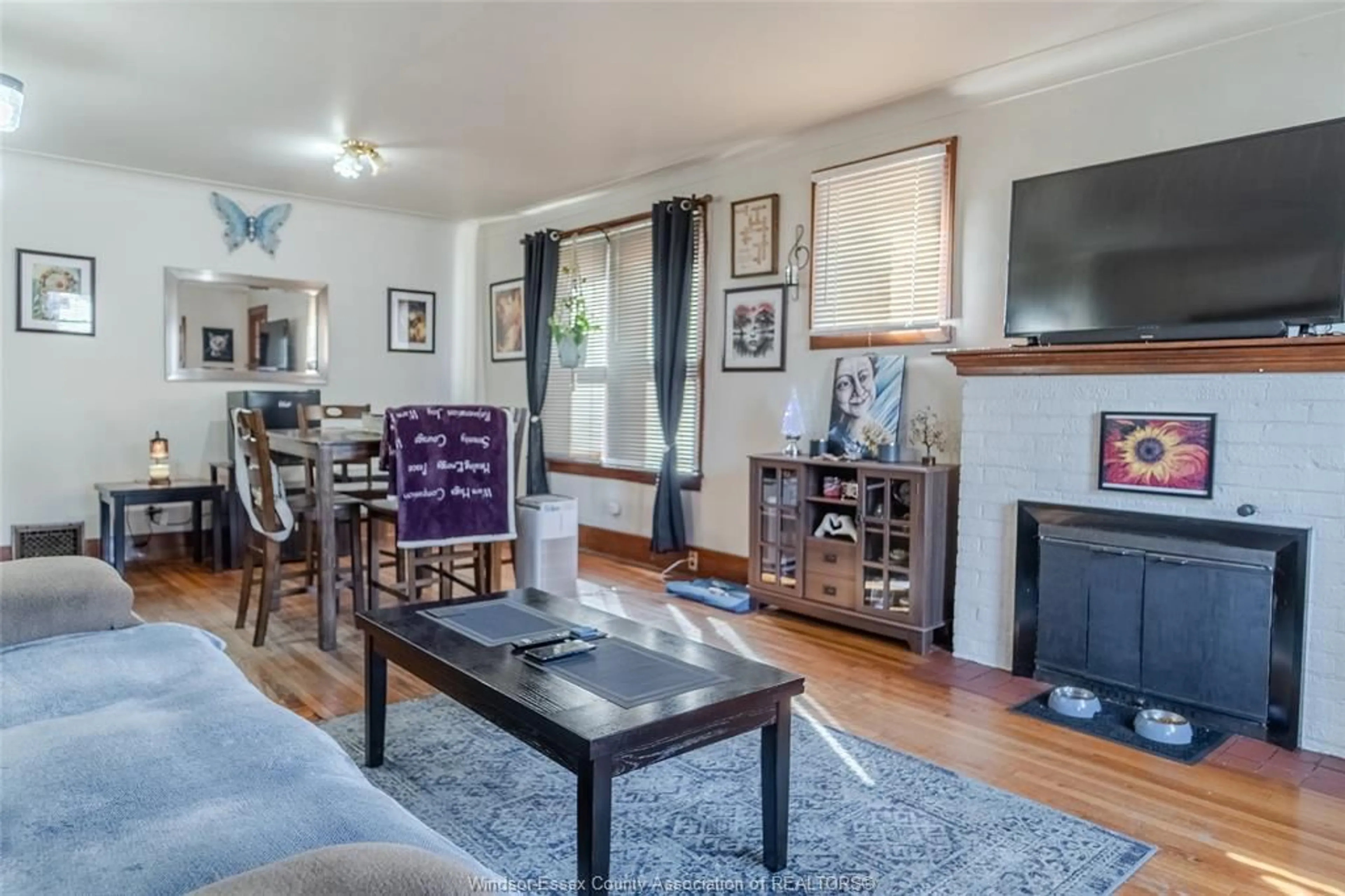 Living room with furniture, wood/laminate floor for 195-97 Hanna St, Windsor Ontario N8X 2N3