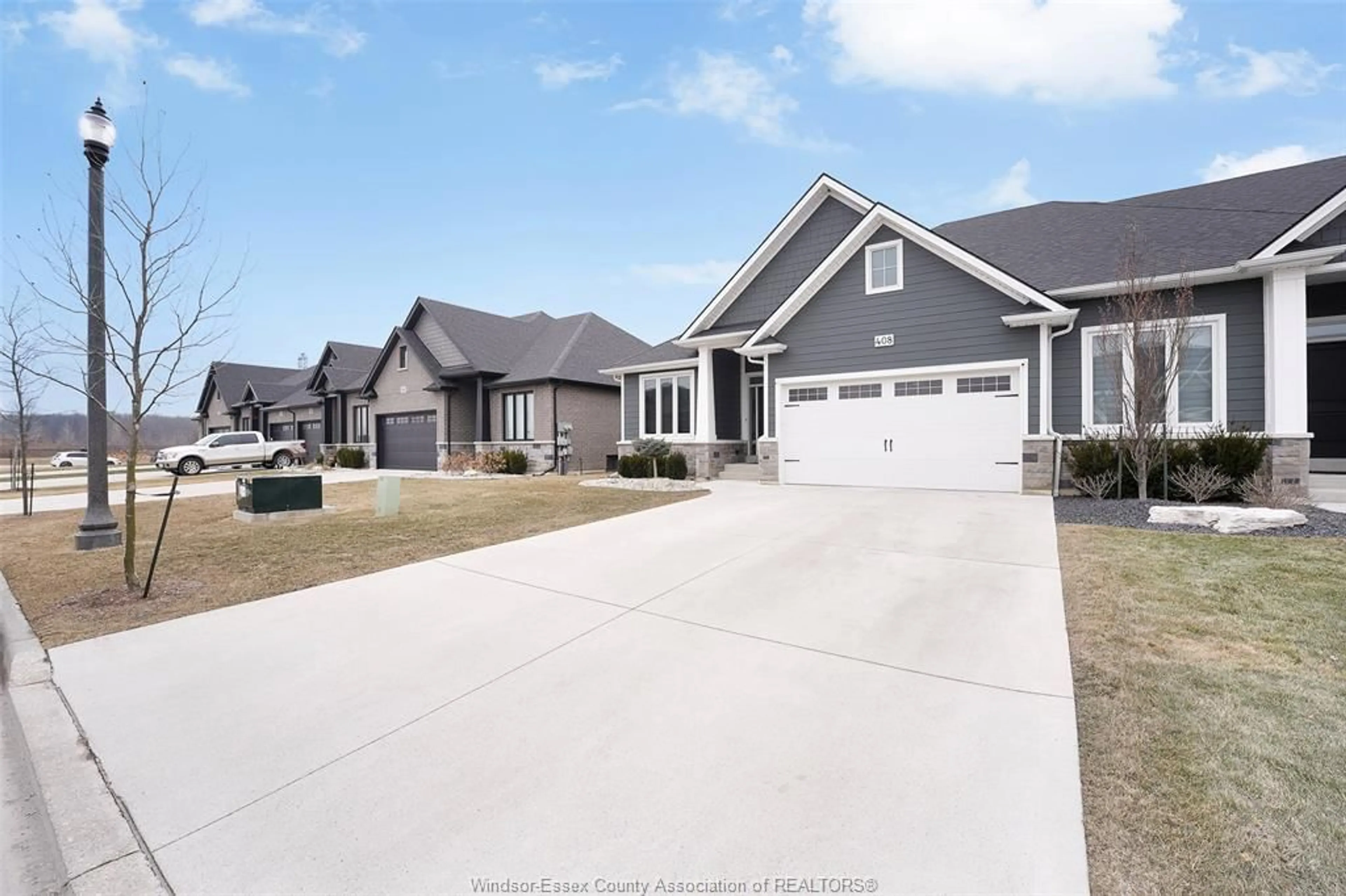 Home with vinyl exterior material, street for 408 MATESE, Lakeshore Ontario N0R 1A0