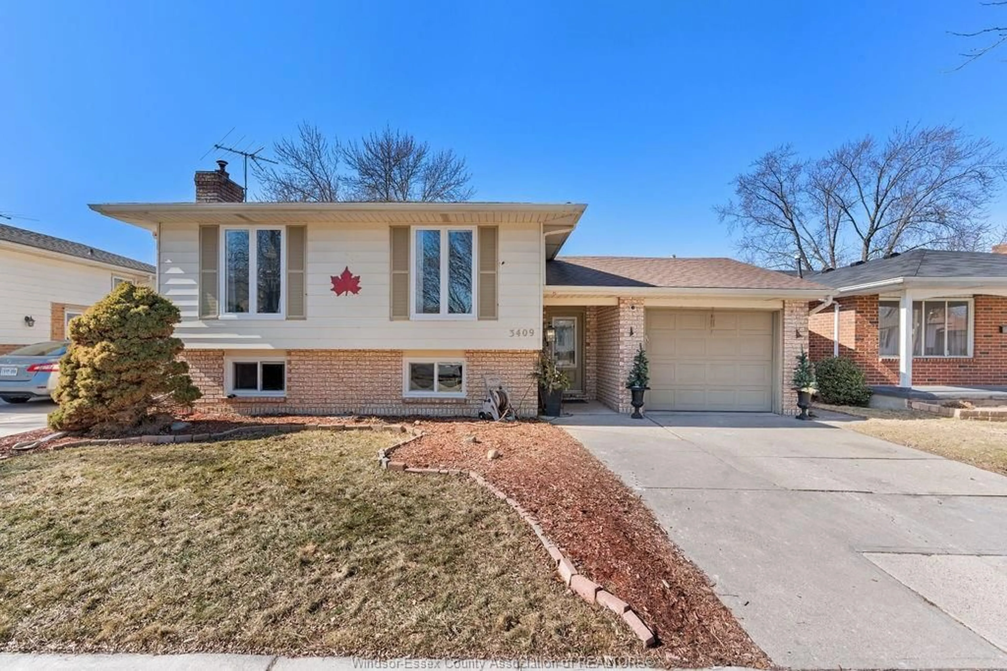 Home with vinyl exterior material, street for 3409 DEERBROOK Dr, Windsor Ontario N8R 2G1