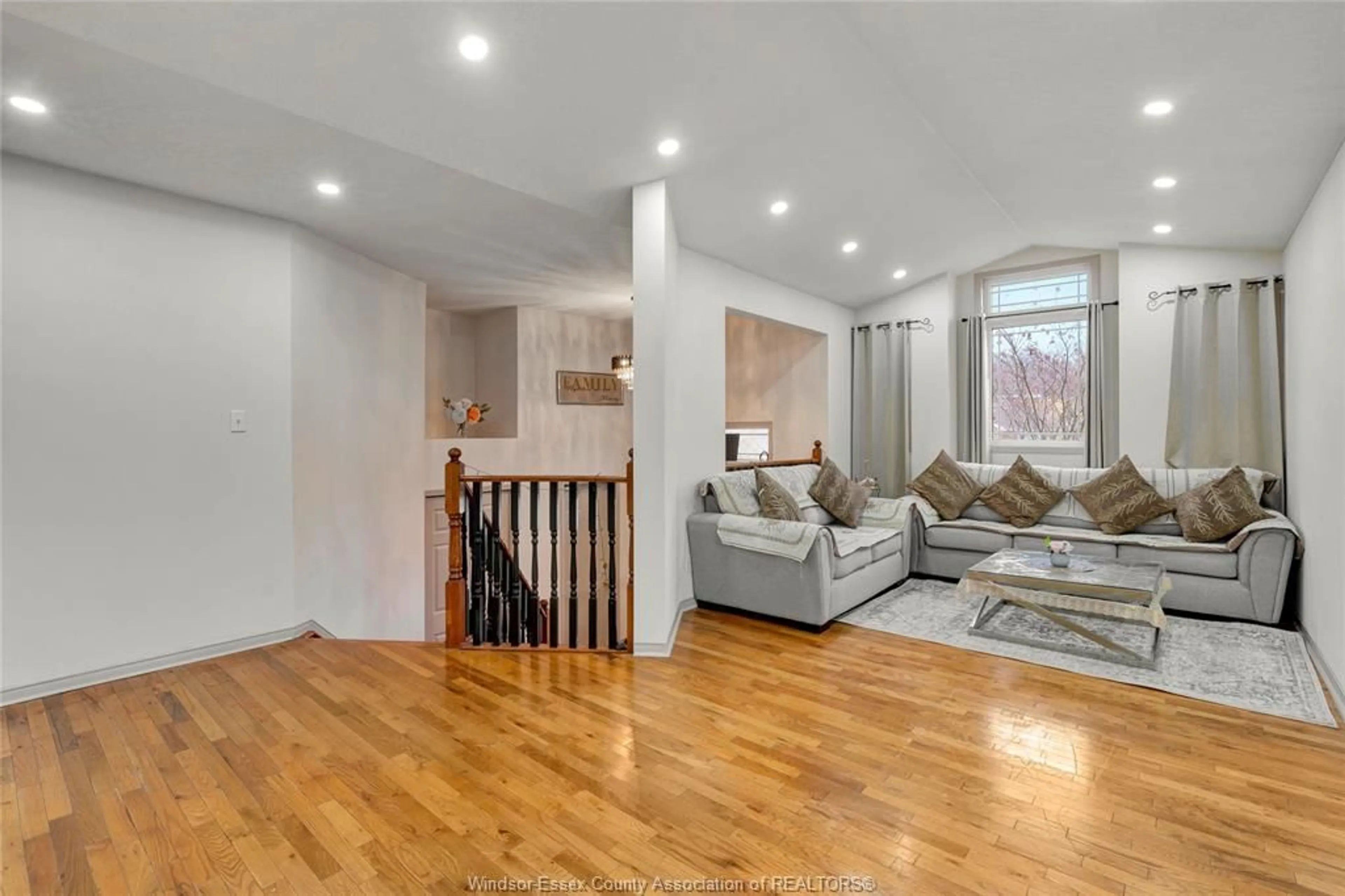 Living room with furniture, wood/laminate floor for 569 SACRED HEART, LaSalle Ontario N9J 3L9