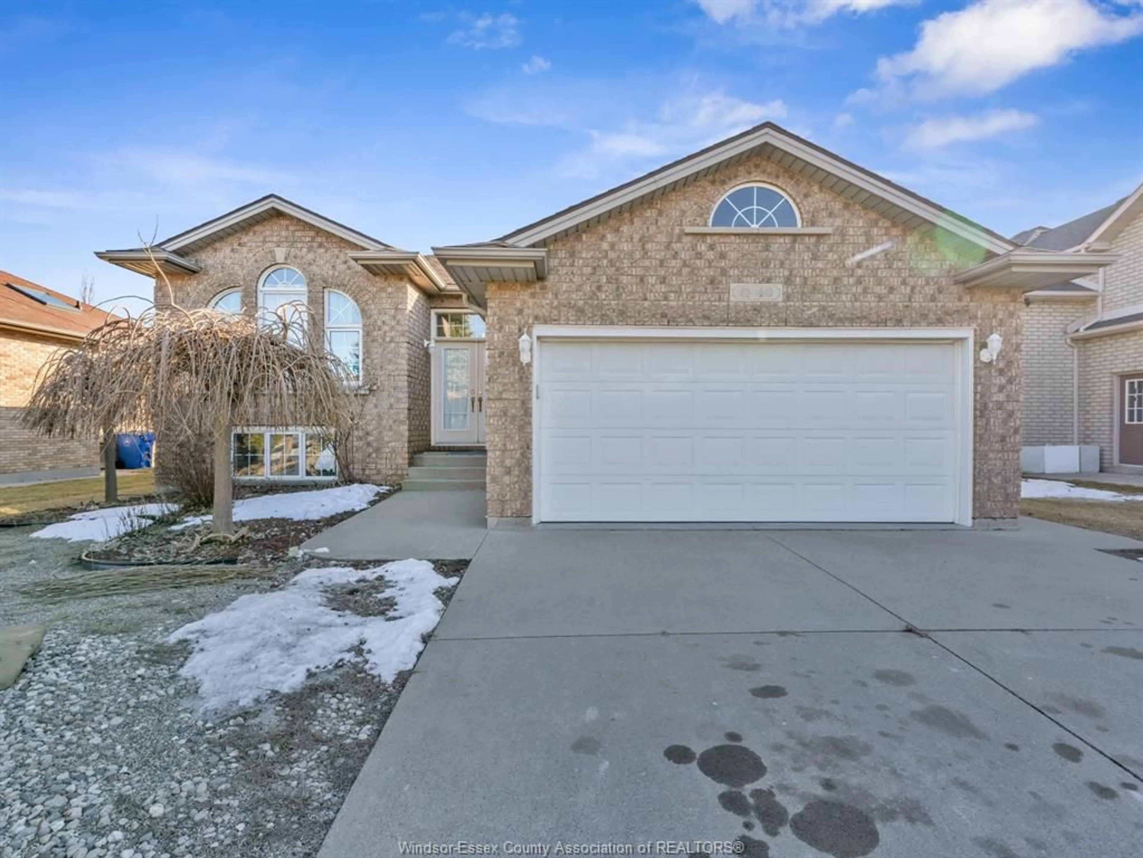 Home with brick exterior material, street for 40 Sandy Lake Dr, Leamington Ontario N8H 5K4