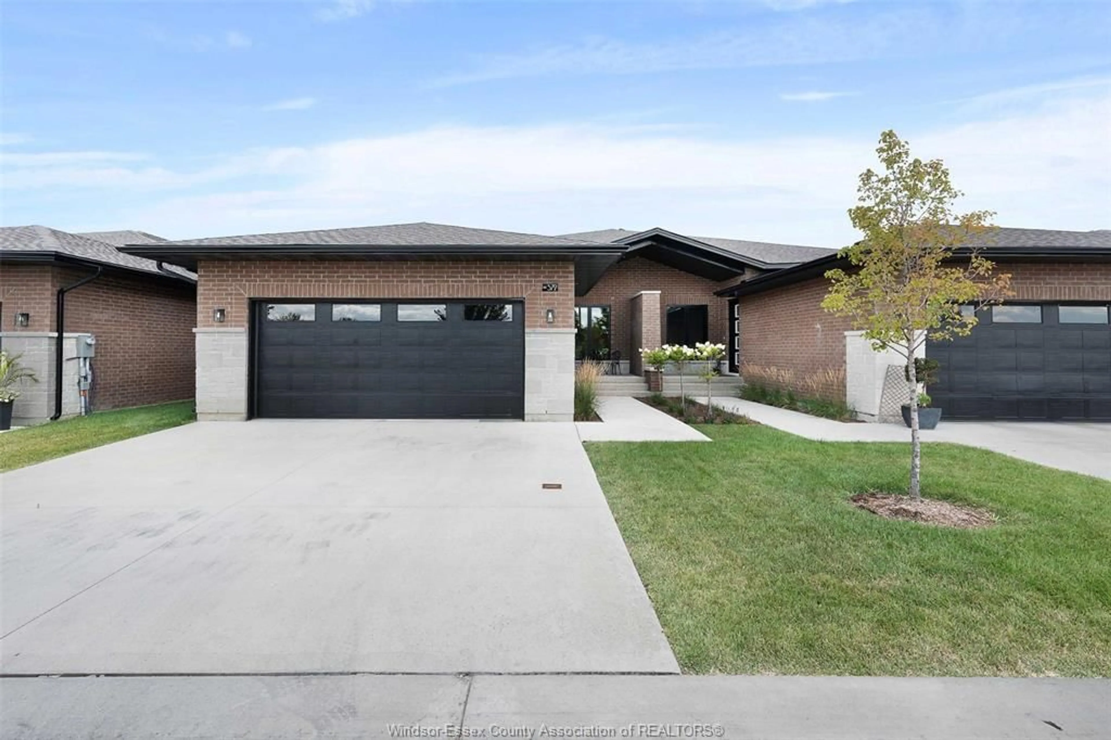 Home with brick exterior material, street for 572 LILY MAC Blvd, Windsor Ontario N6E 3N7