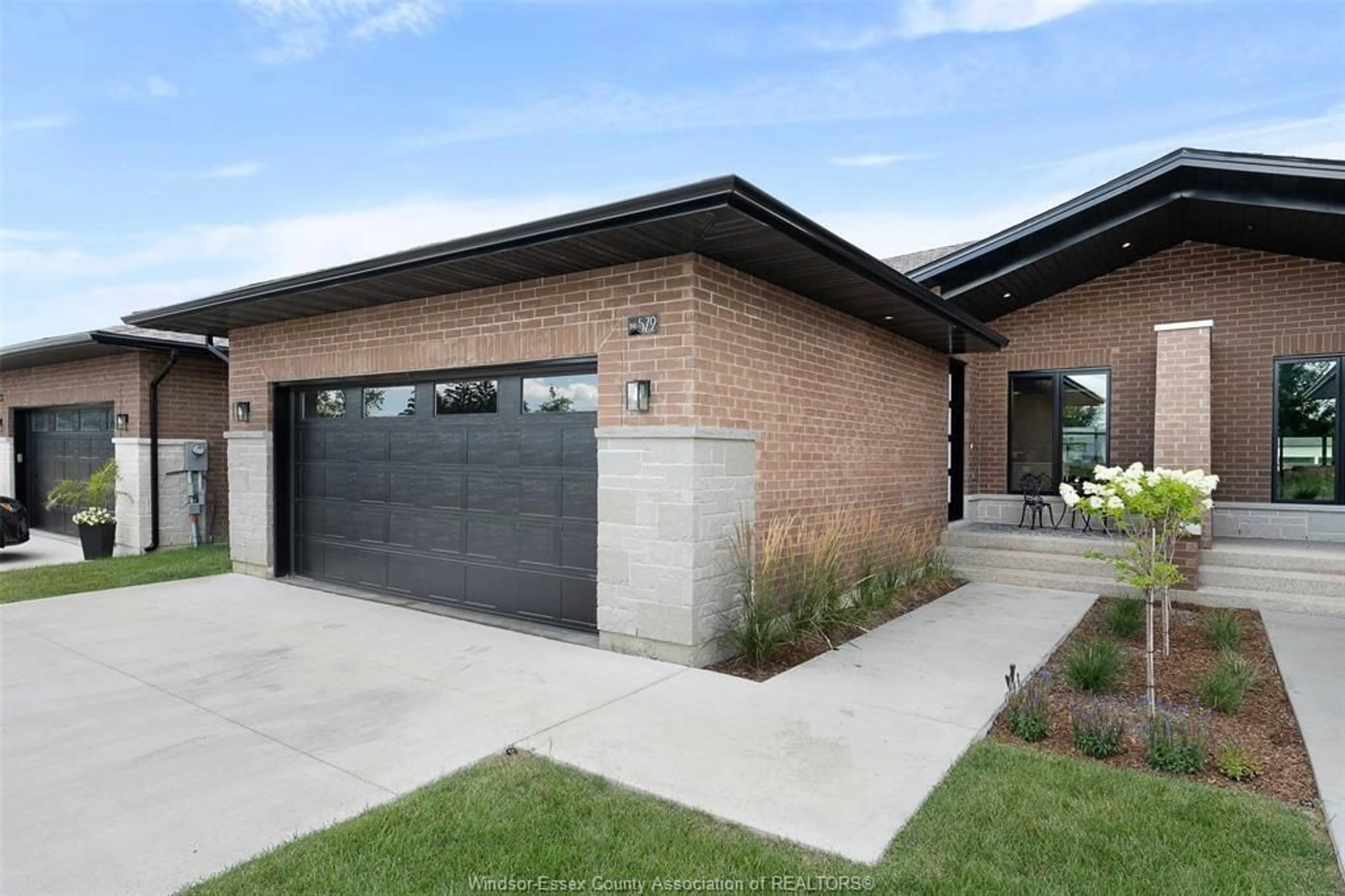 Home with brick exterior material, street for 572 LILY MAC Blvd, Windsor Ontario N6E 3N7