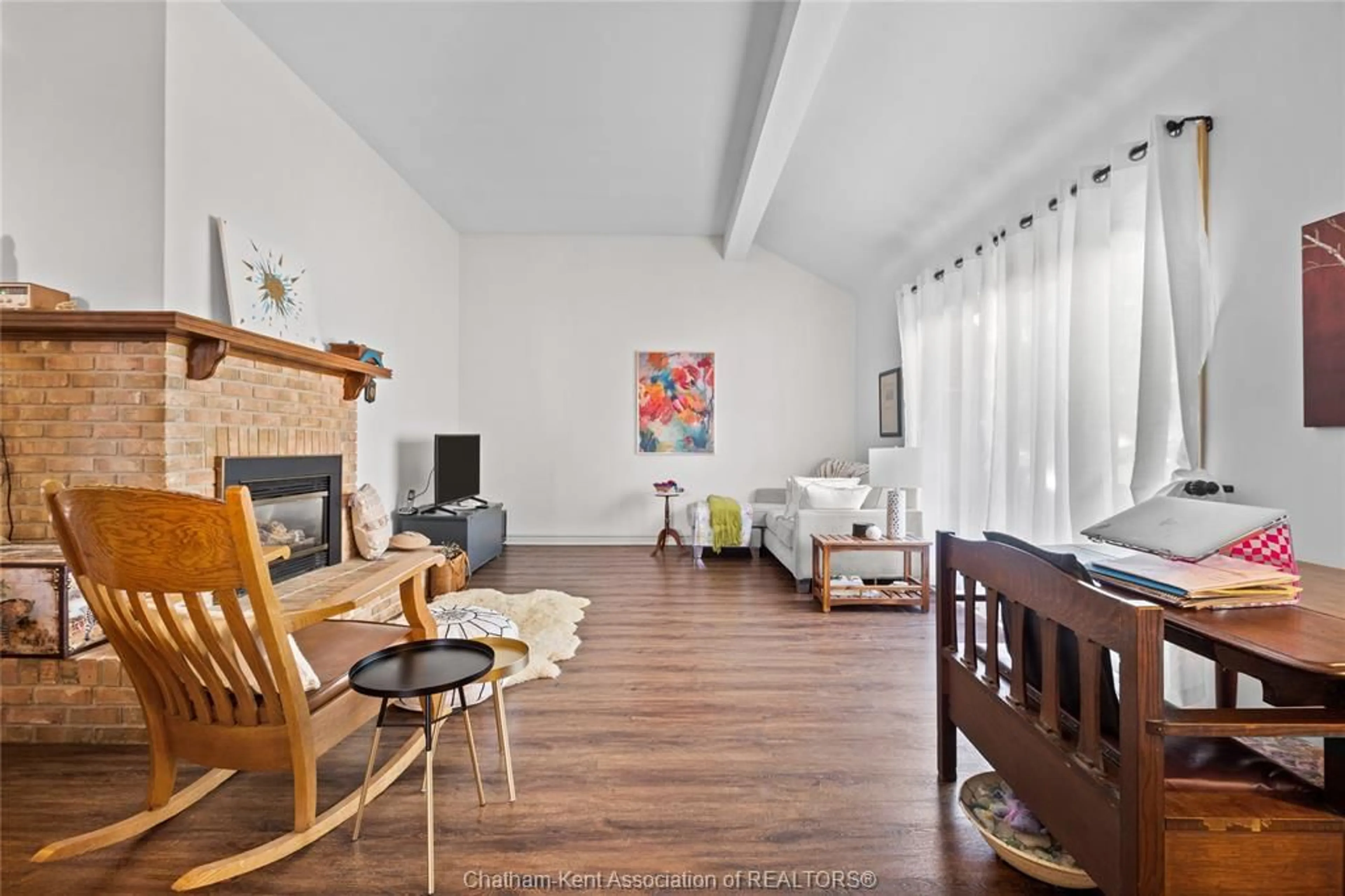 Living room with furniture, wood/laminate floor for 9164 Talbot Trail, Blenheim Ontario N0P 1A0