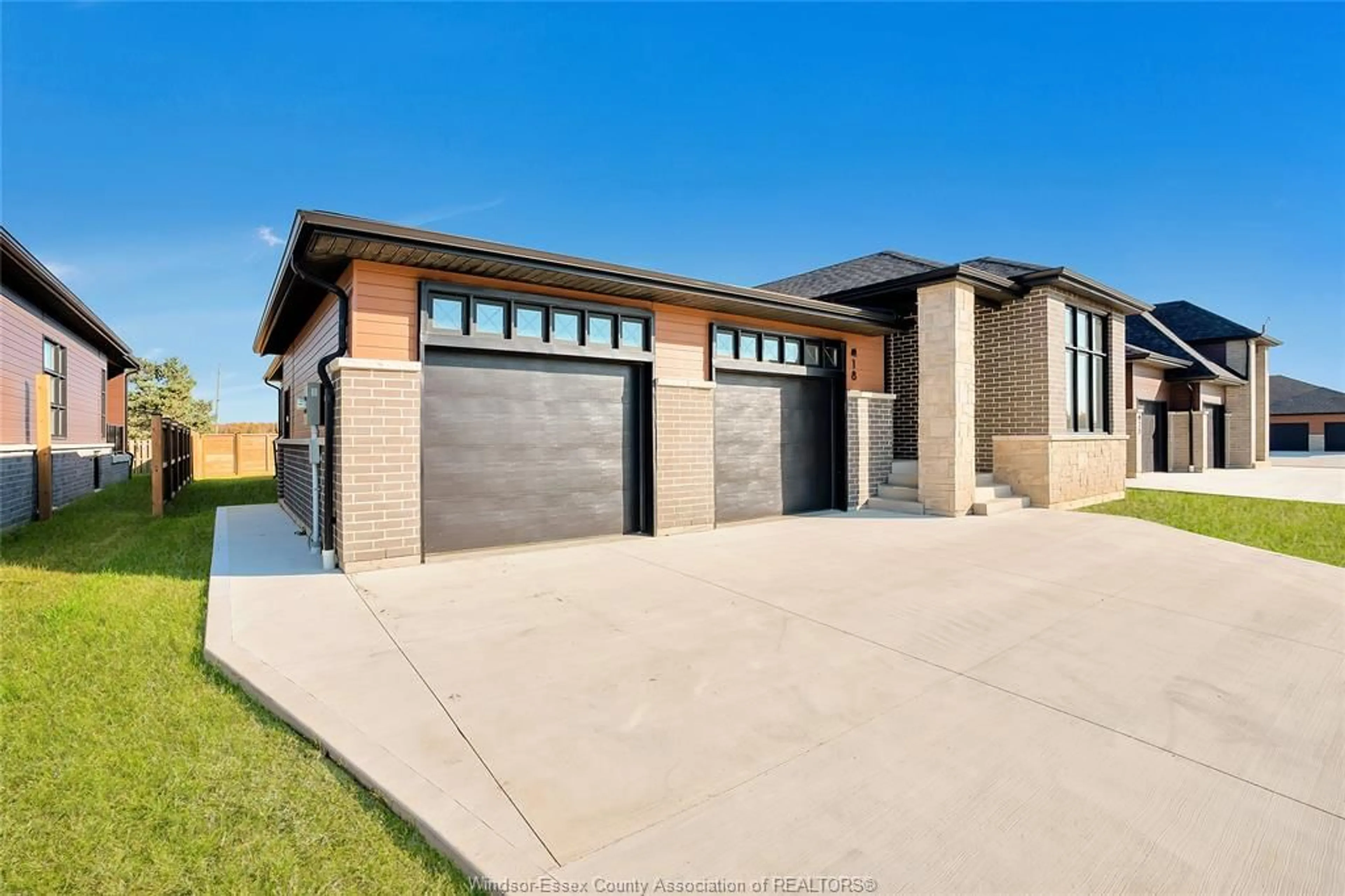 Home with brick exterior material, street for 18 WOODLAND St, Kingsville Ontario N9Y 0A9