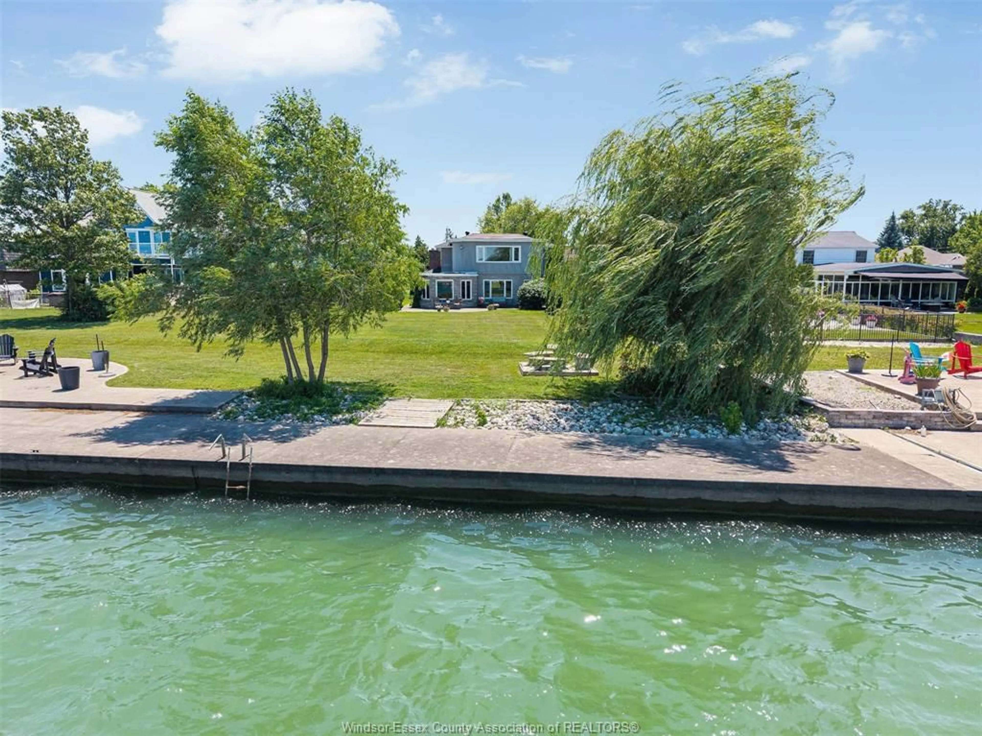 A pic from outside/outdoor area/front of a property/back of a property/a pic from drone, water/lake/river/ocean view for 11830 RIVERSIDE Dr, Windsor Ontario N8P 1A6