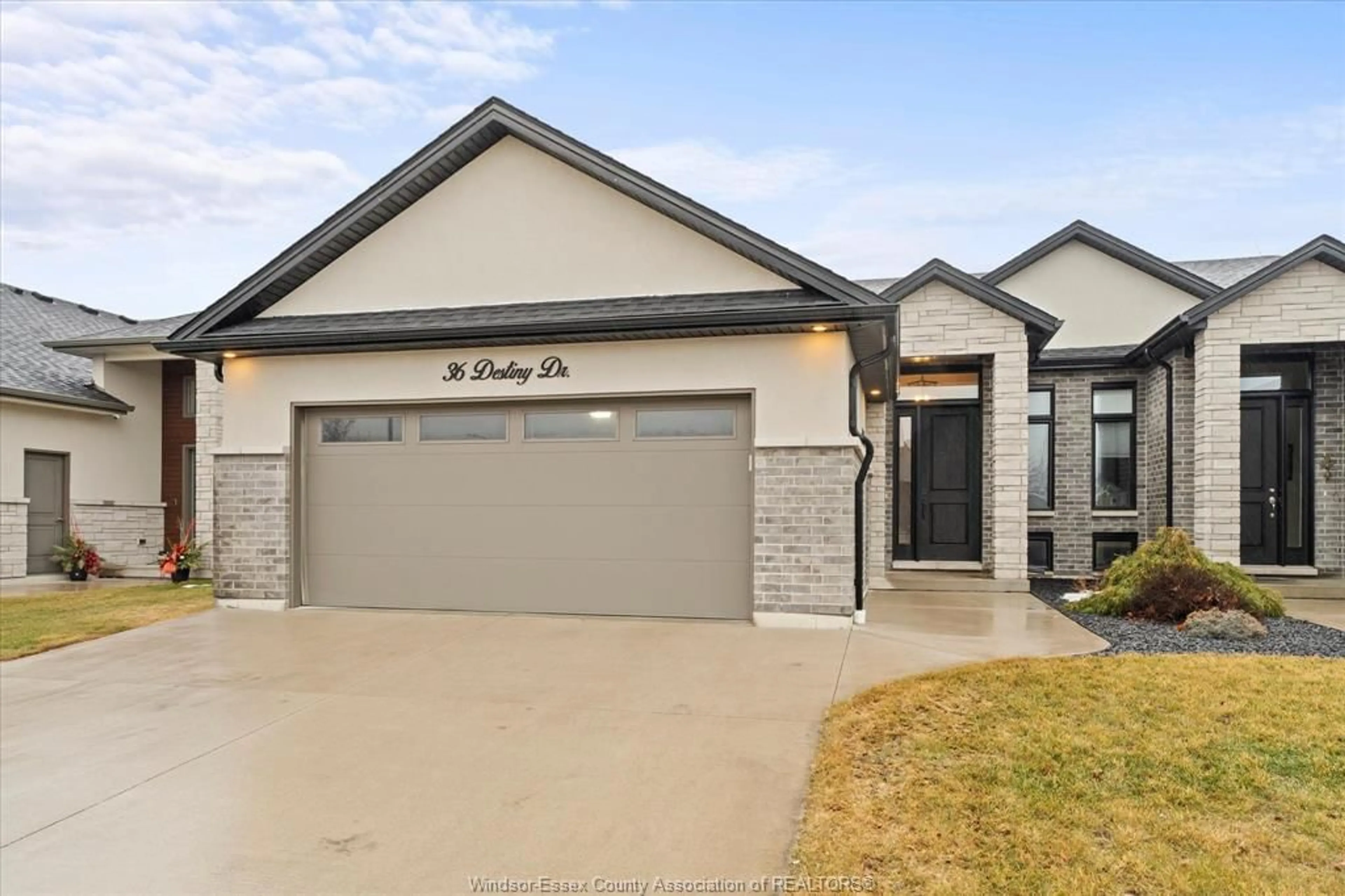 Home with brick exterior material, street for 36 DESTINY Dr, Leamington Ontario N8H 0E1